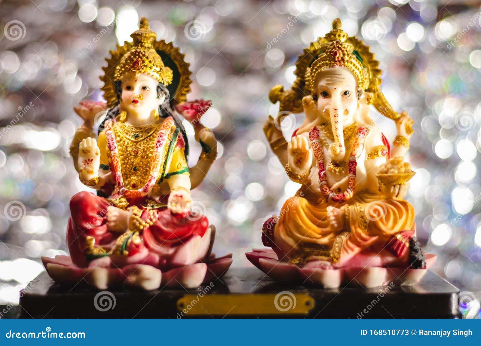 ganesh-luxmi statues on bokeh background - dhan-teras concept