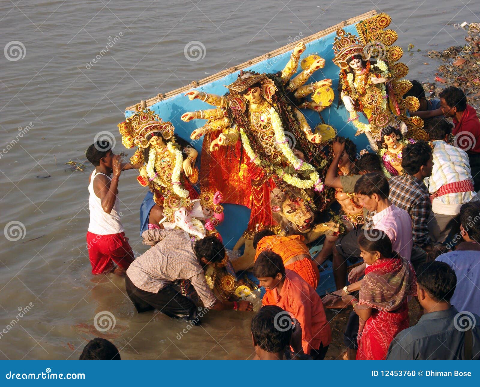 GANGA POLUTION. THE HINDU DEITY BEING IMMERSED IN THE RIVER GANGES AFTER THE FAMOUS FESTIVAL OF DURGA.