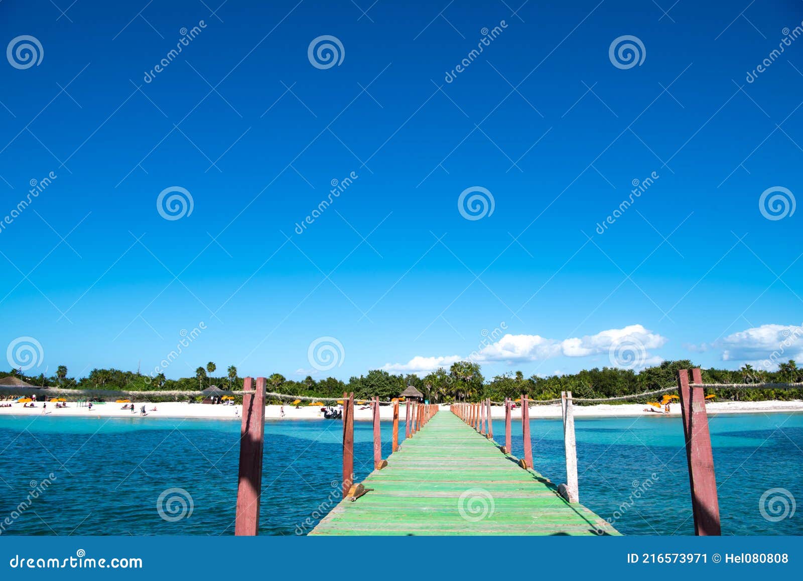 gangplank with green planks leading to beautiful beach of punta frances, isla de juvetud, cuba