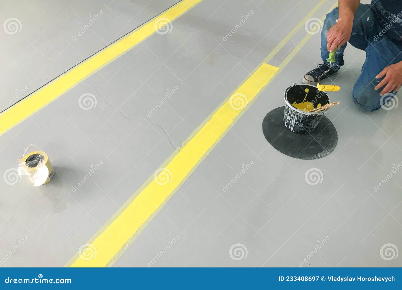 Garage Floor Painting, Yellow Markings in the Garage Stock Image