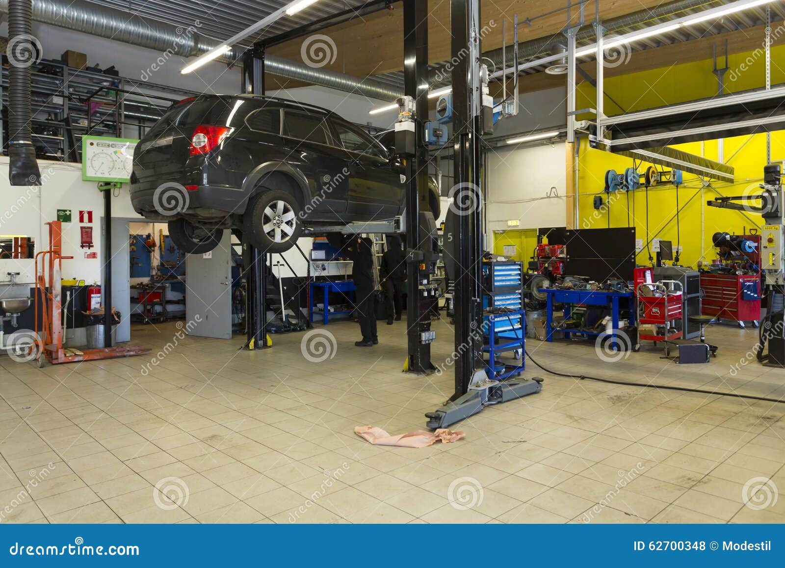 Garage Mechanics stock photo. Image of garage, engine 62700348