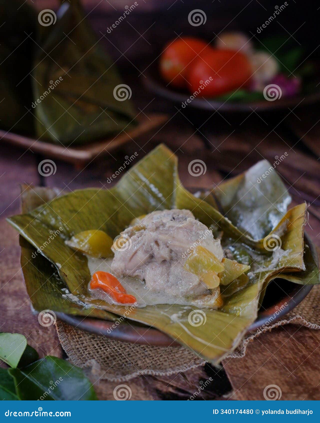 garang asem is a processed chicken dish that is cooked using banana leaves and is dominated by sour and spicy flavors.