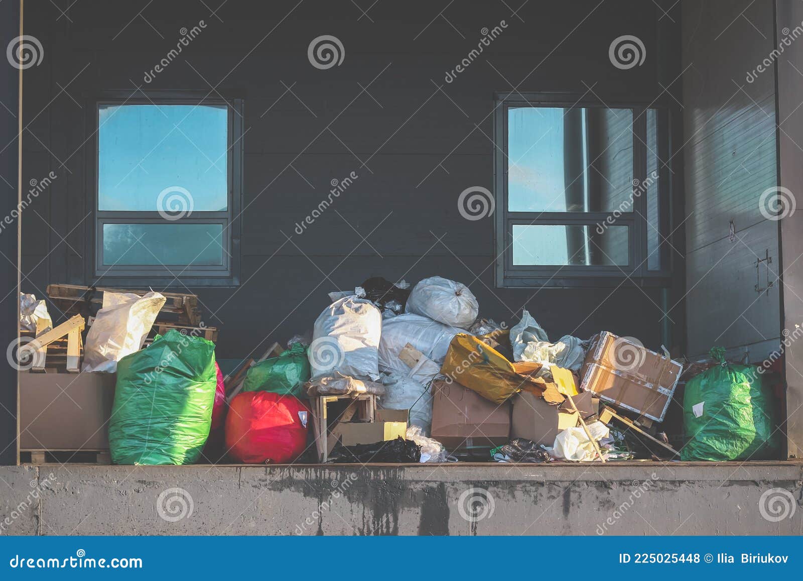 Garbage Bags and Boxes on the Loading Dock. Waste Removal Stock Photo