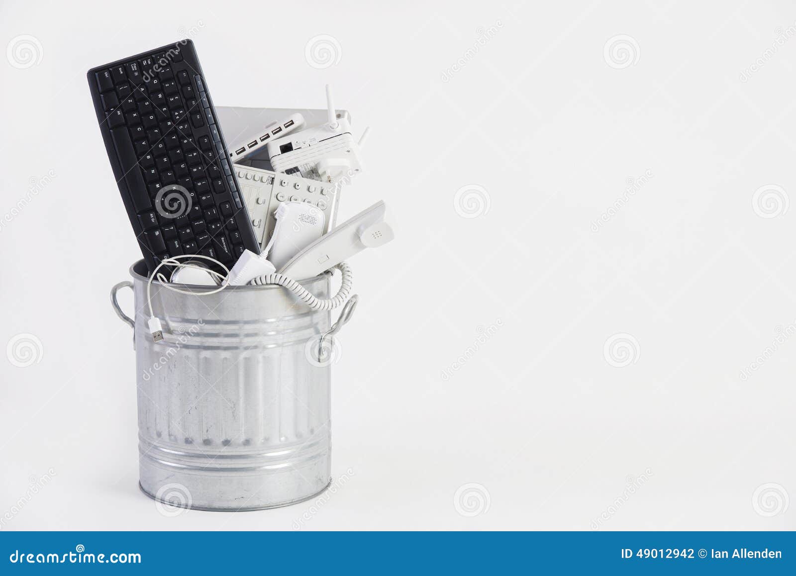 Garbage Can Filled with Obsolete Office Equipment Stock Photo Image