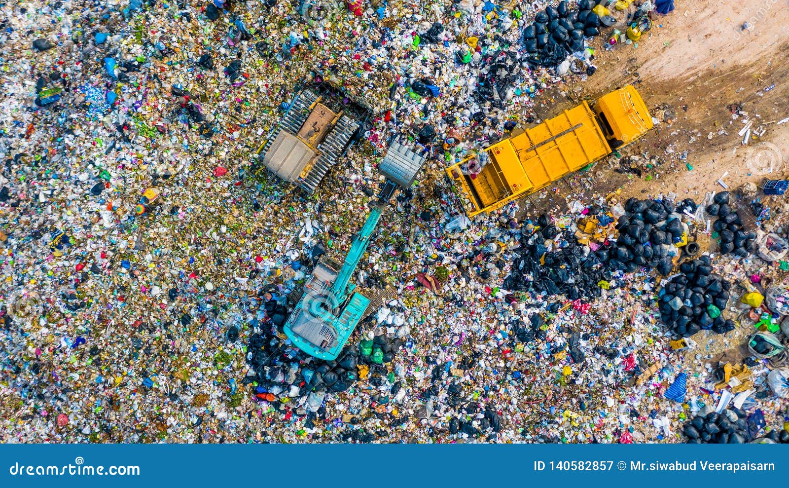 garbage pile in trash dump or landfill, aerial view garbage trucks unload garbage to a landfill, global warming
