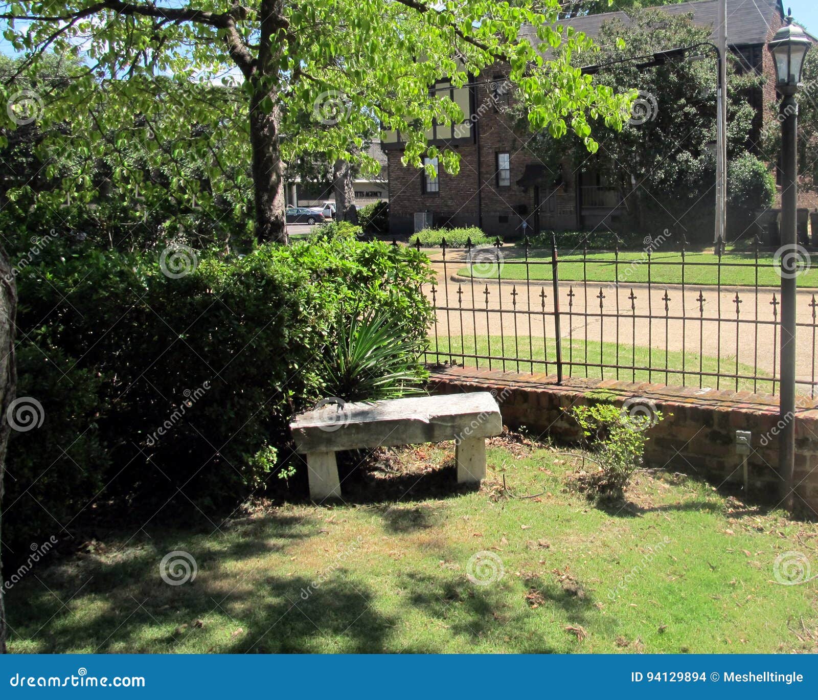 Garden Bench with Metal Fence and Greenery Stock Photo Image of