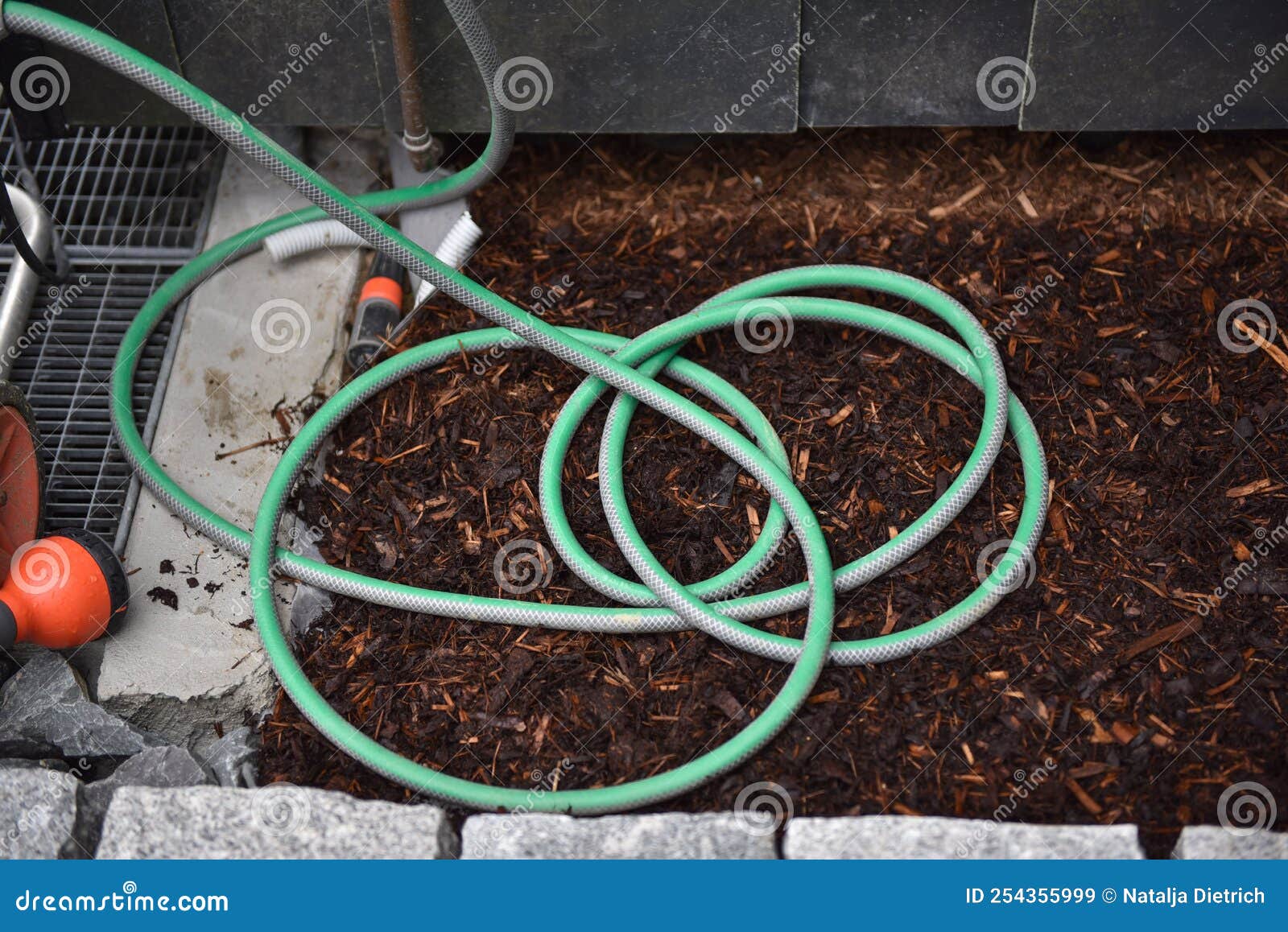 Garden hose on the floor stock image. Image of round 254355999
