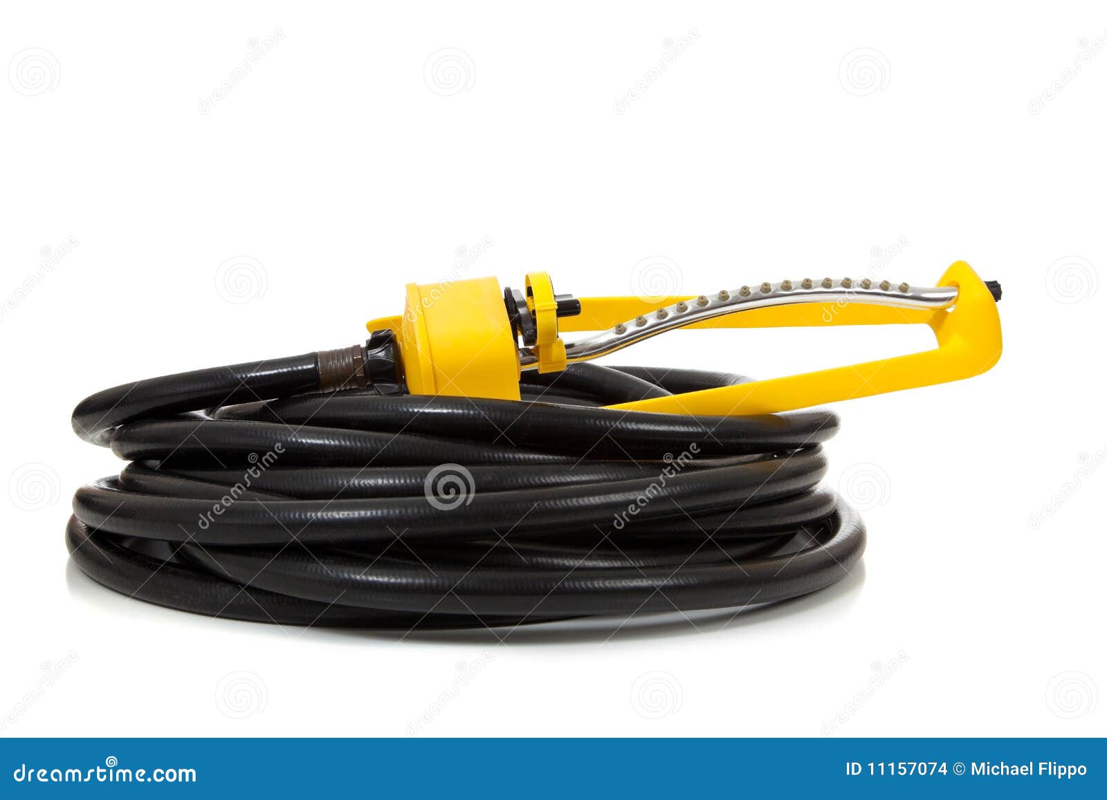 Garden hose and sprinkler stock photo. Image of garden 11157074