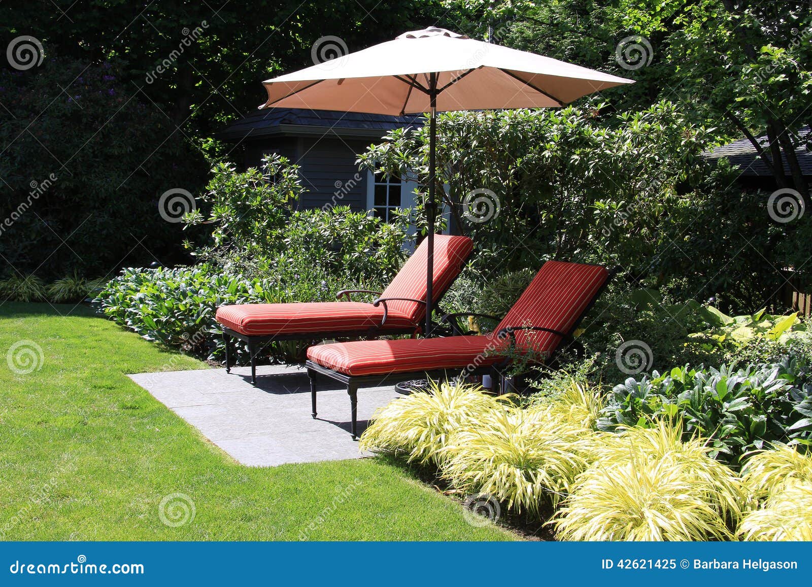 Garden lounge chairs stock image. Image of greenery, landscape 42621425