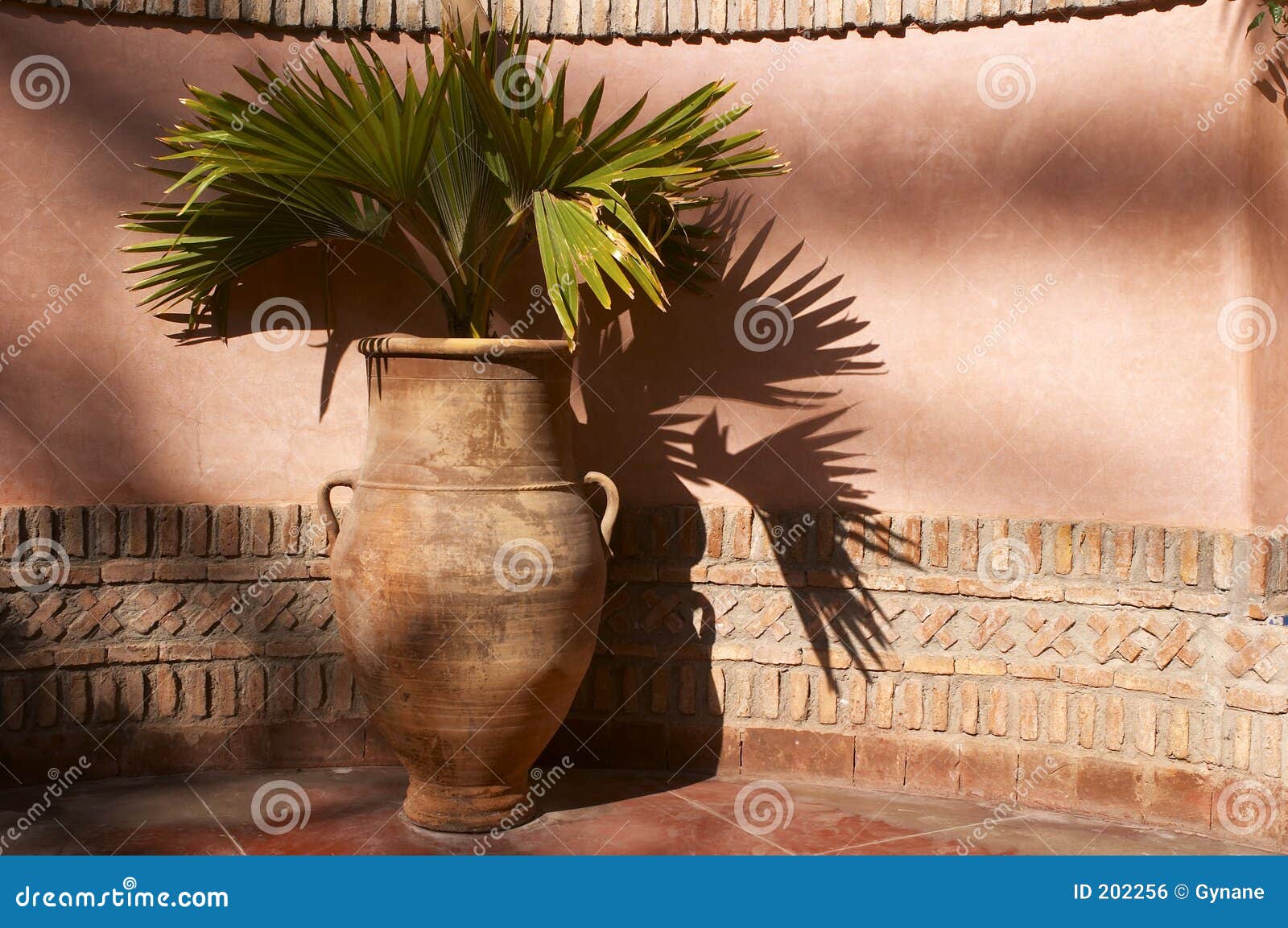 garden urn with palm leaves