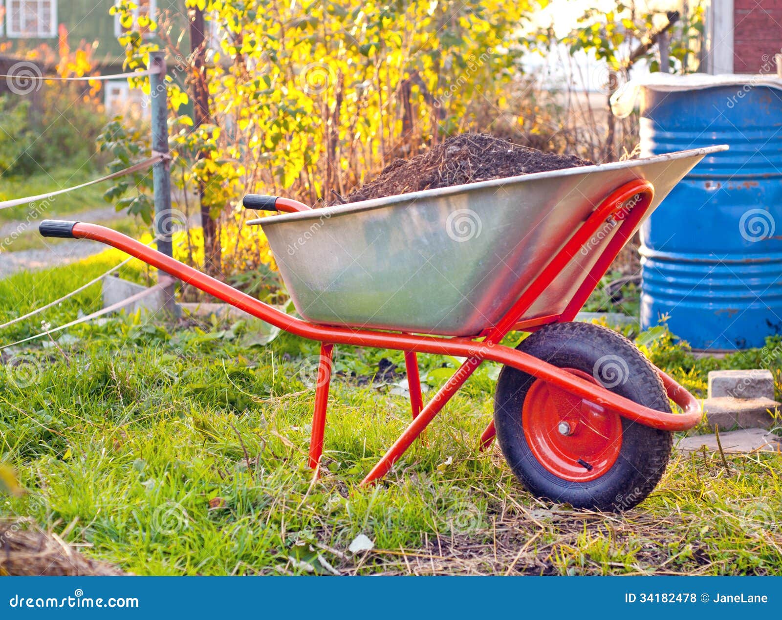 Garden wheelbarrow stock photo. Image of landscape, ground 34182478