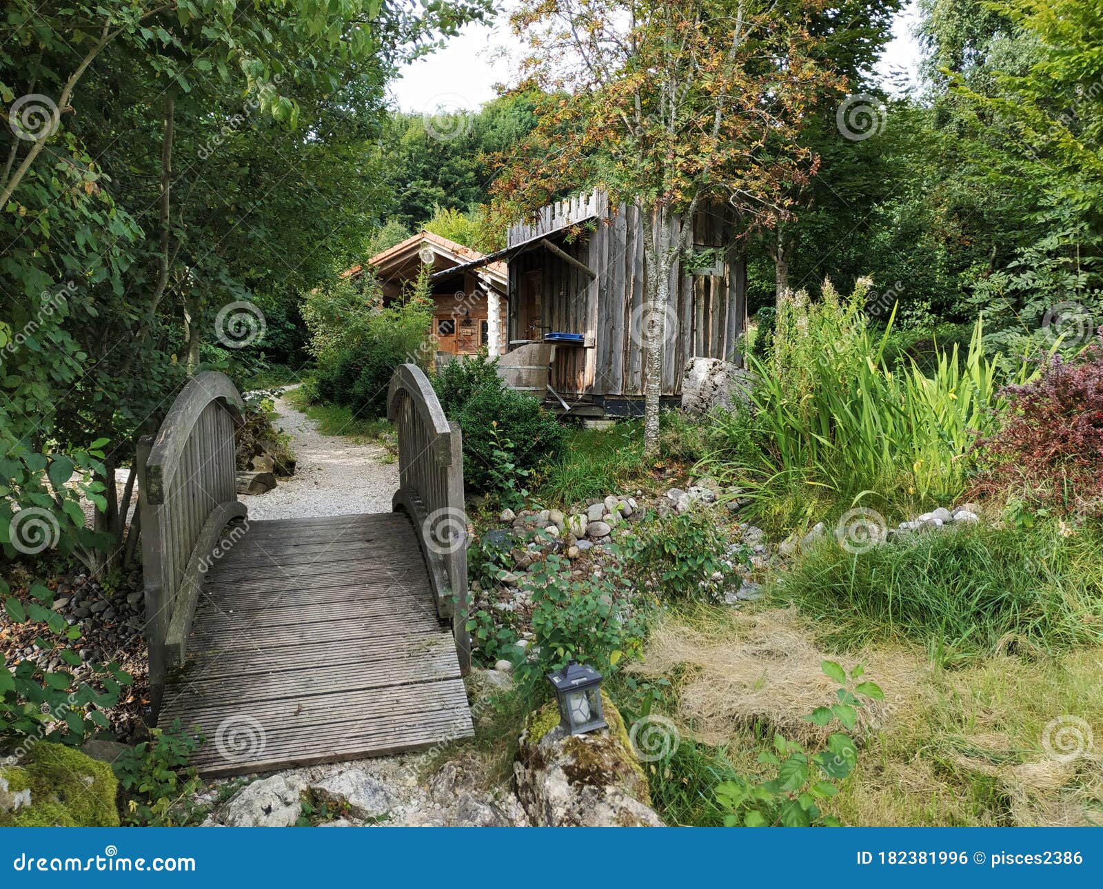 Garden with Wooden Bridge and Wooden House Stock Photo Image of