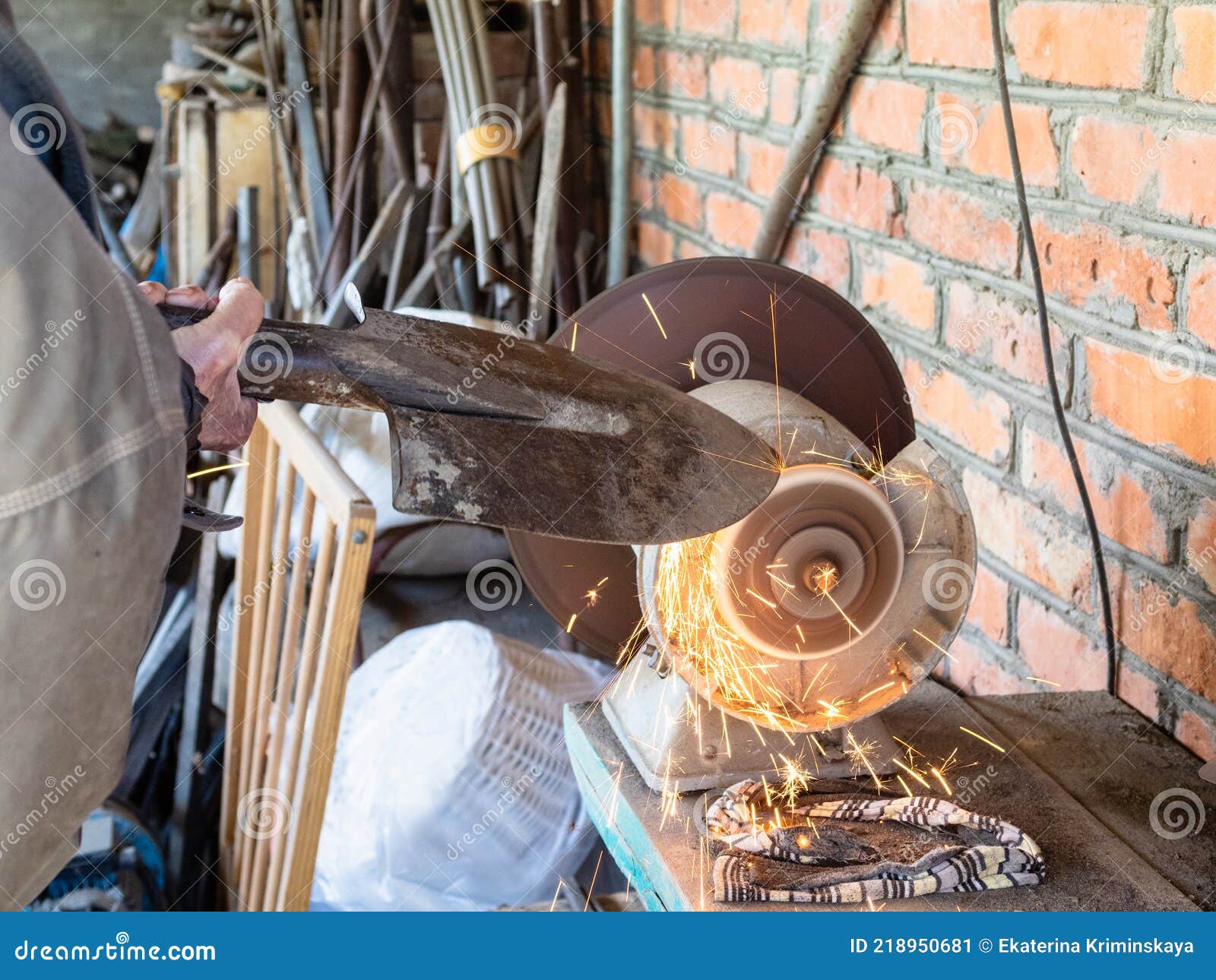 Gardener Sharpens Shovel on Electric Grinder Stock Image Image of