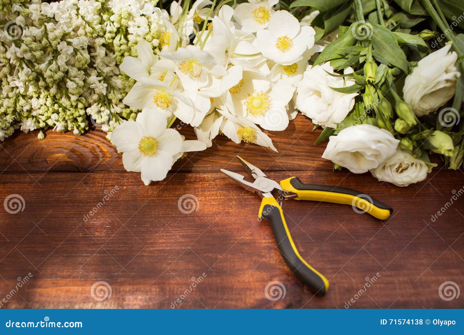 gardening tools, plants and soil on vintage wooden table. spring in the garden concept background with free text space.