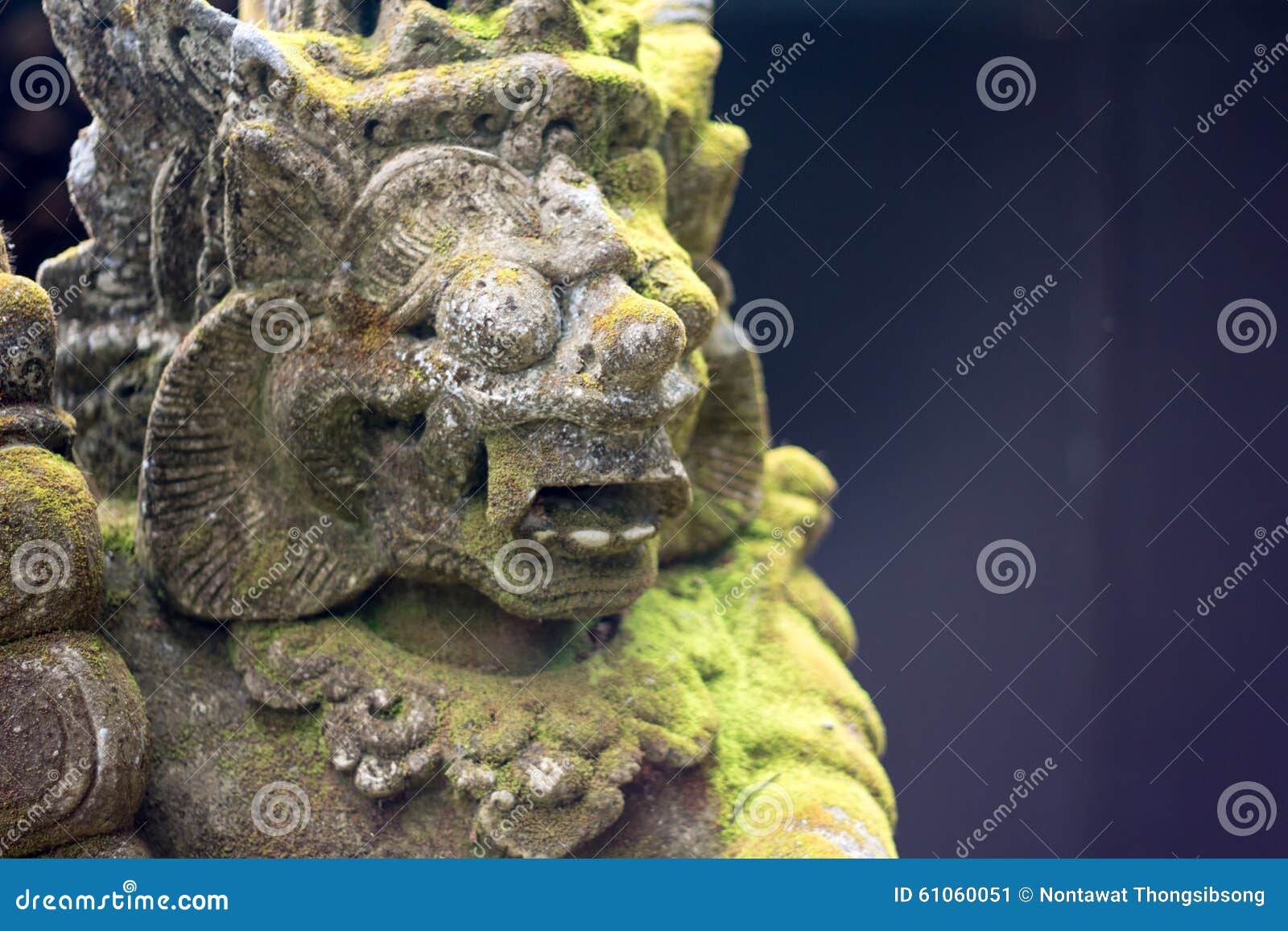 gardian statue covered with moss