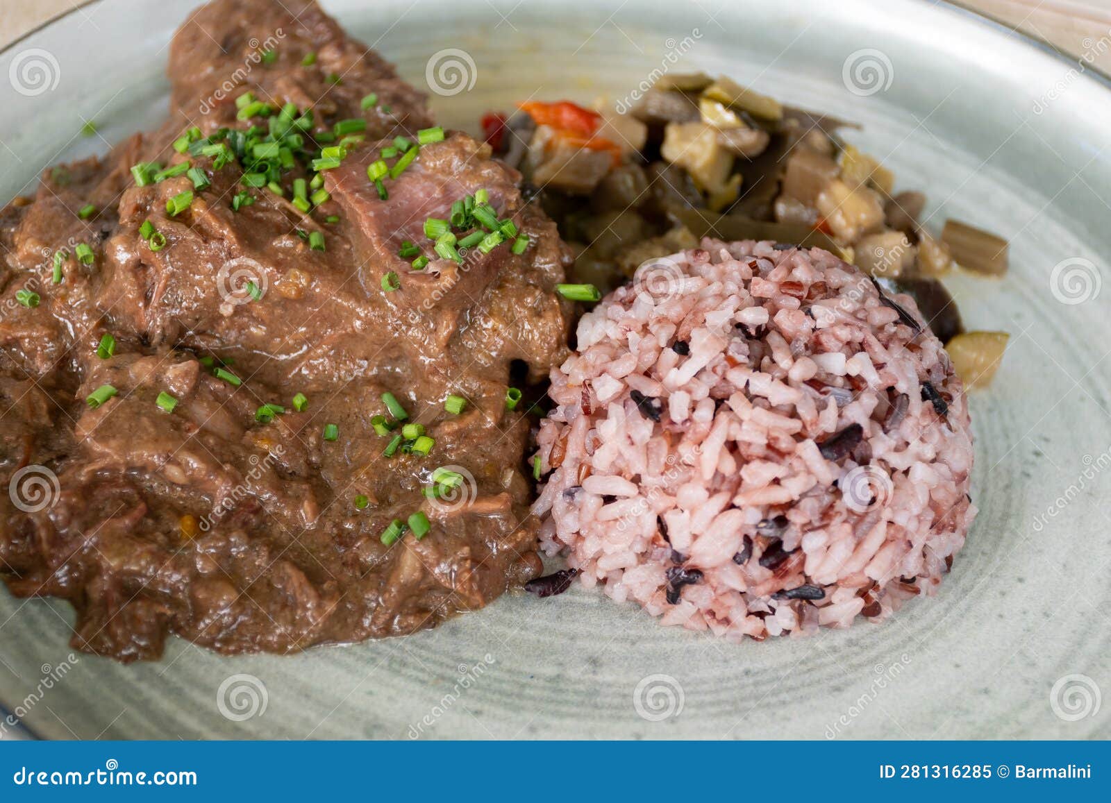 gardiane de taureau, gardianne, or daube camarguaise bull slow cooked stew served with rice from camargue with vegetables, tastes