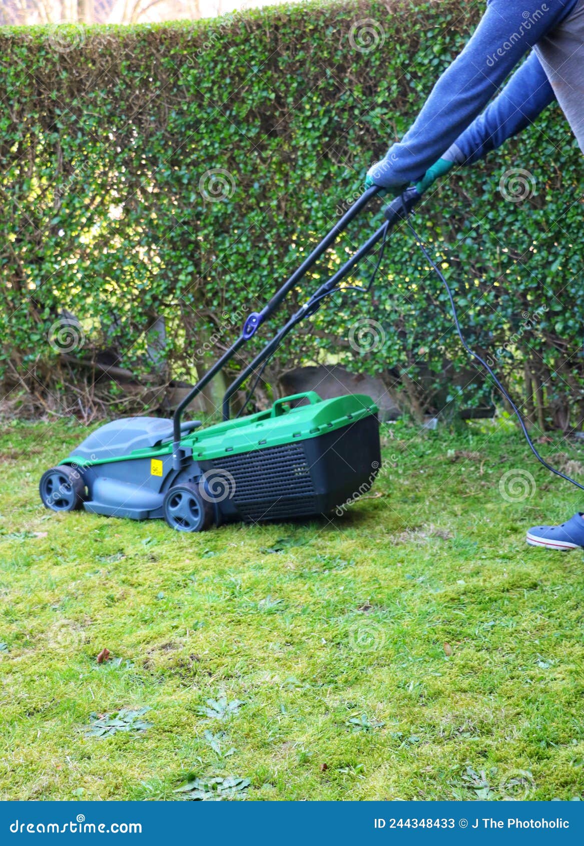 A Gardner Cut the Lawn with a Electric Lawn Mower Machine Stock Image Image of machinery, lawn