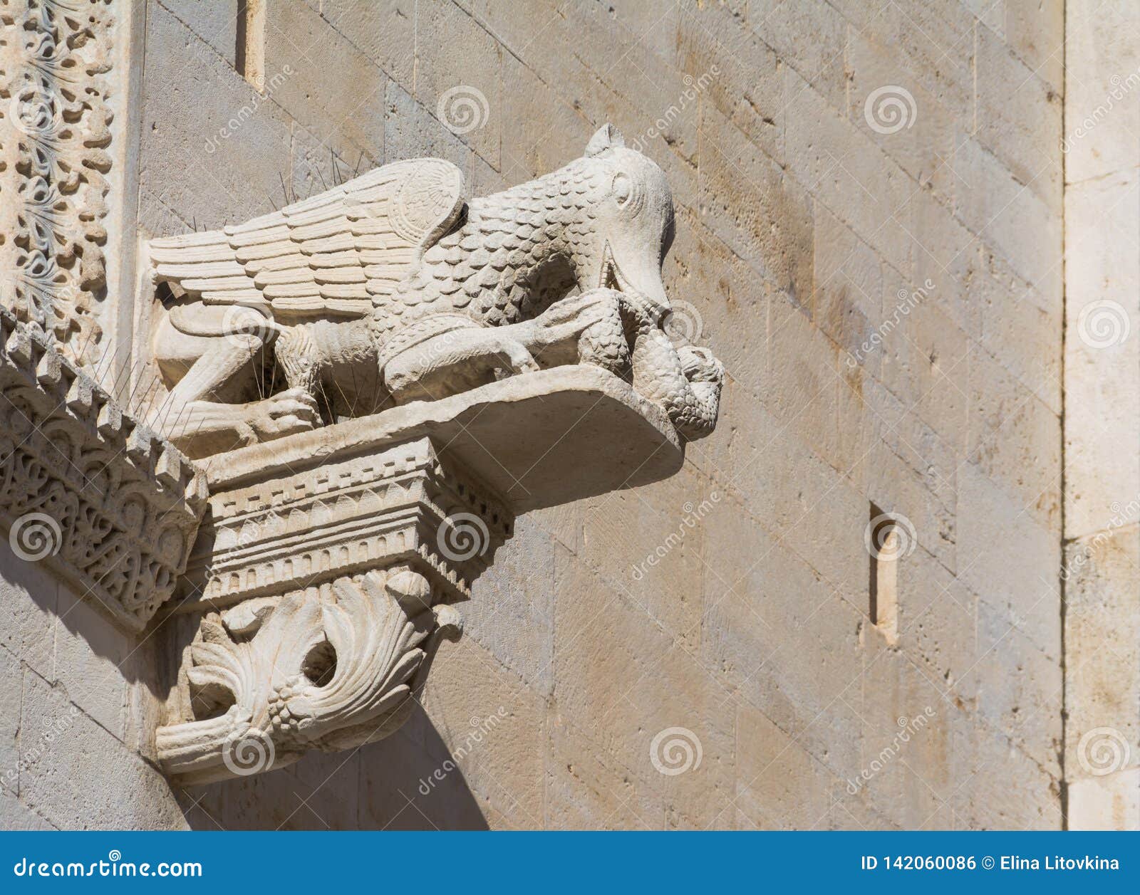 Gargoyle eating snake stock photo. Image of apulia, decor 142060086