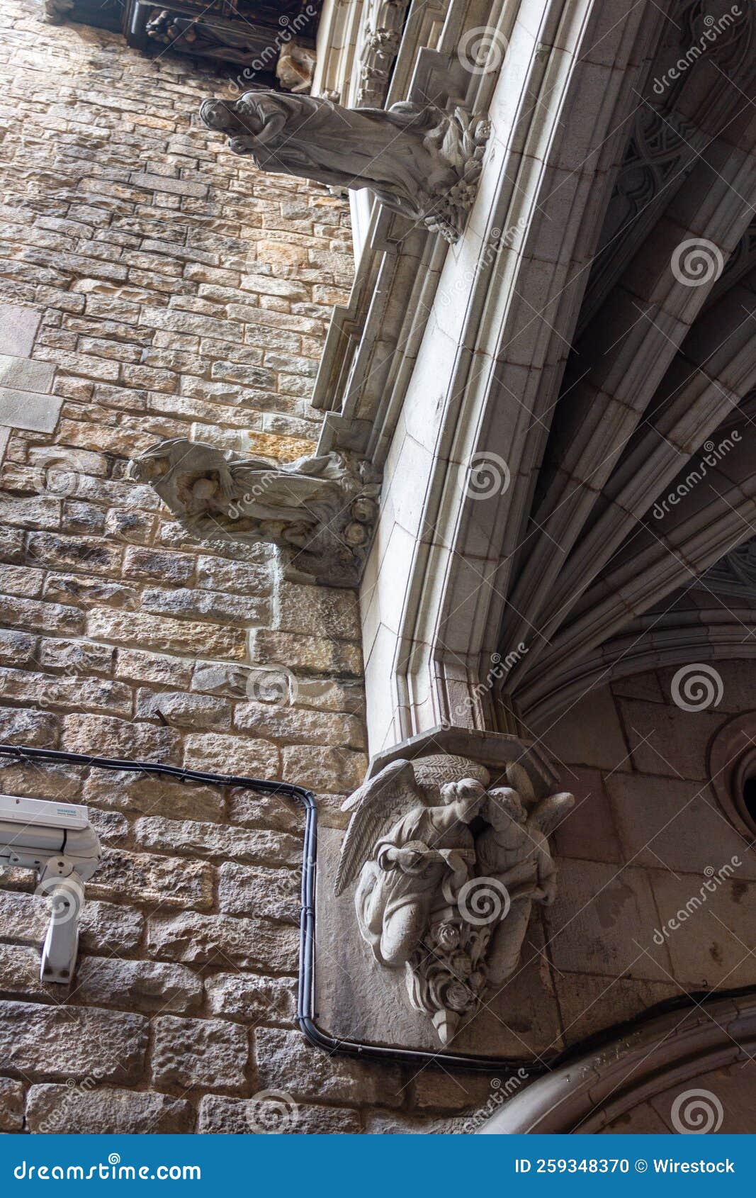 gargoyle statues on the wall of the cathedral in ciutat vella,  barcelona, spain