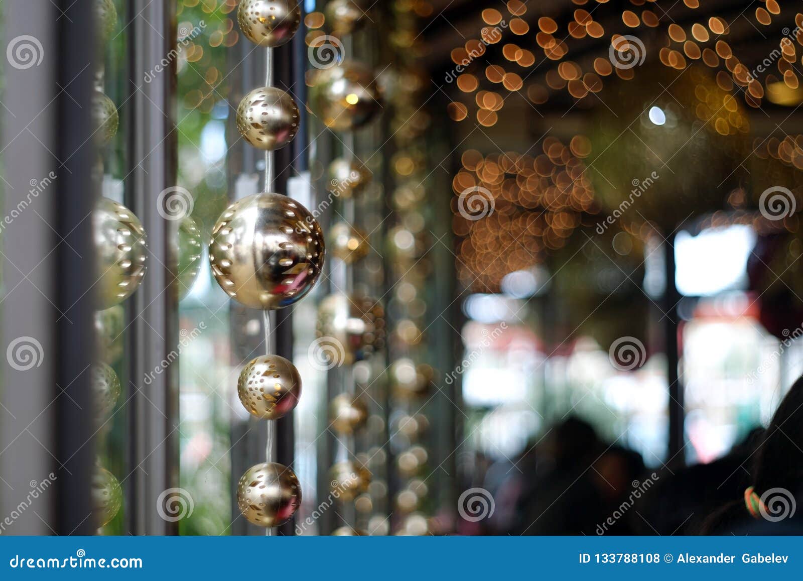 Garland of Christmas Balls Hangs on a Window . Stock Photo - Image of ...