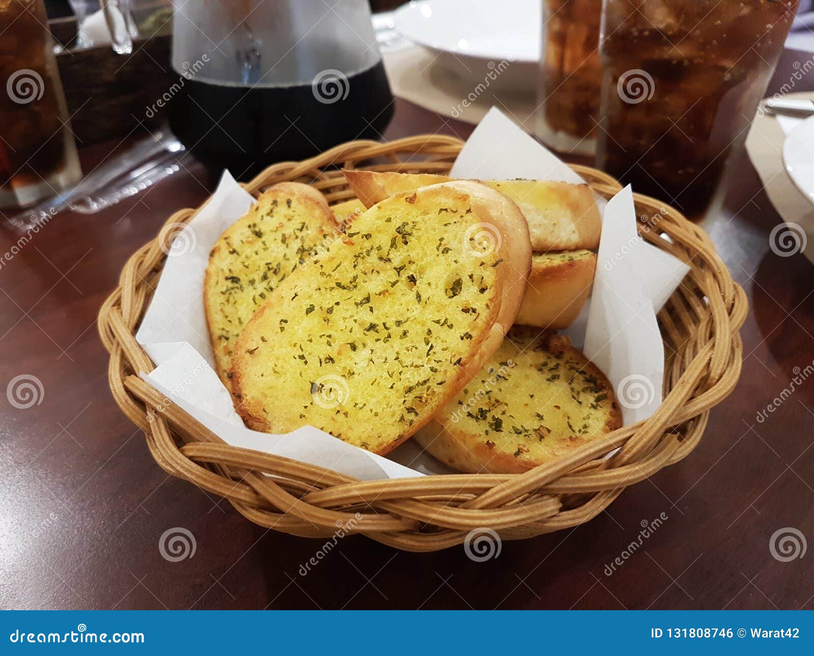 Garlic bread in basket stock photo. Image of crispy 131808746