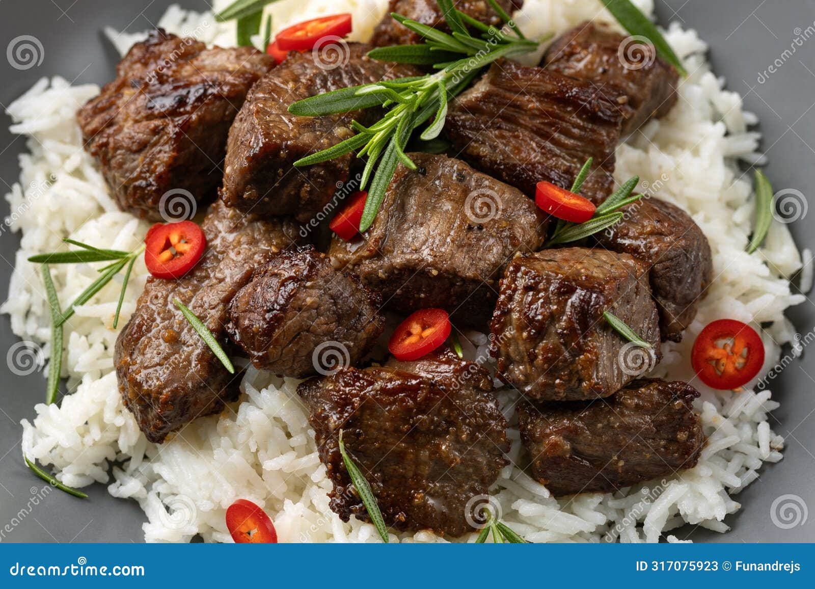 Garlic Butter Beef Steak Bites with Rice Stock Image Image of cooked