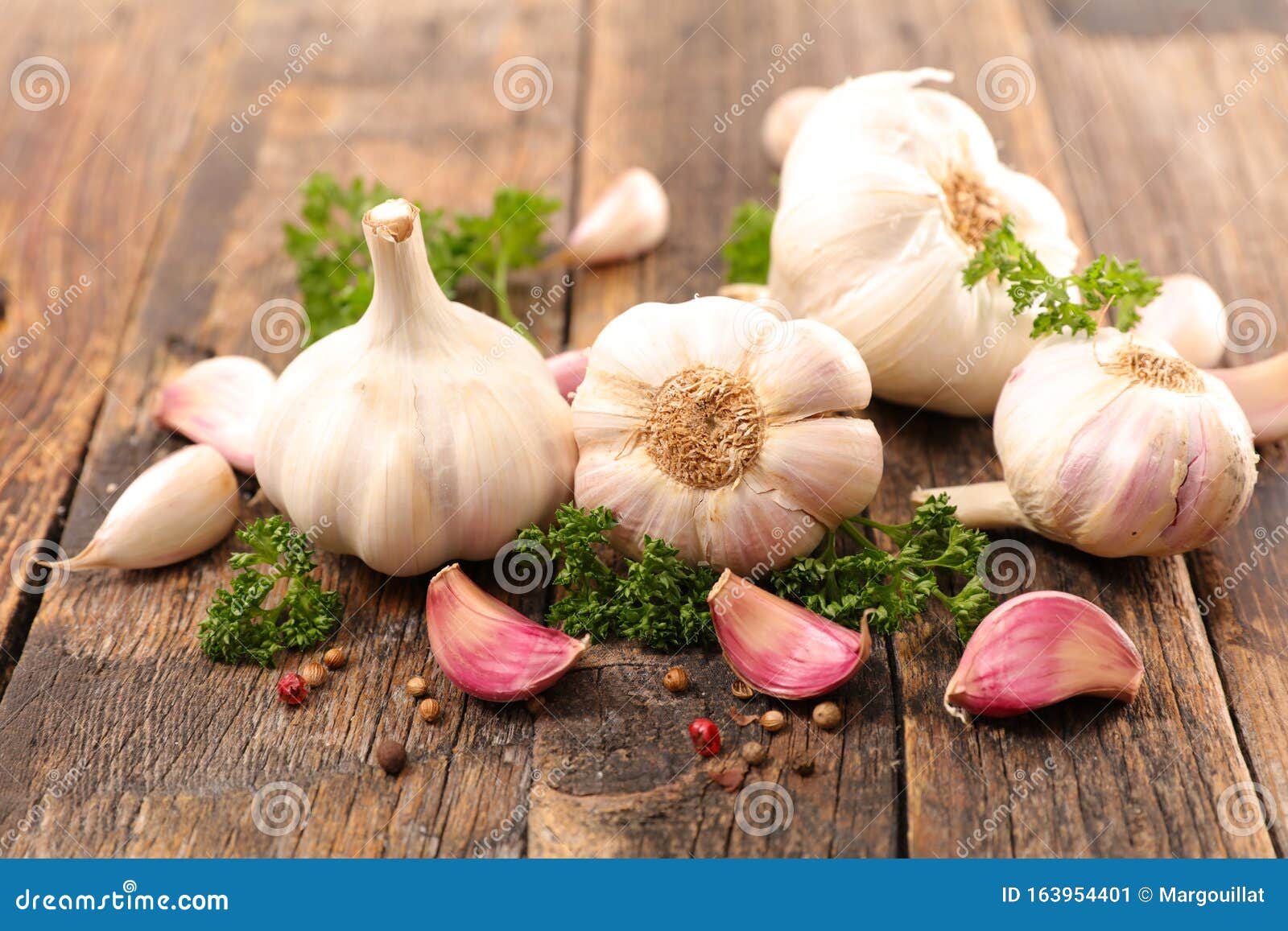Garlic clove with herb stock image. Image of pepper 163954401