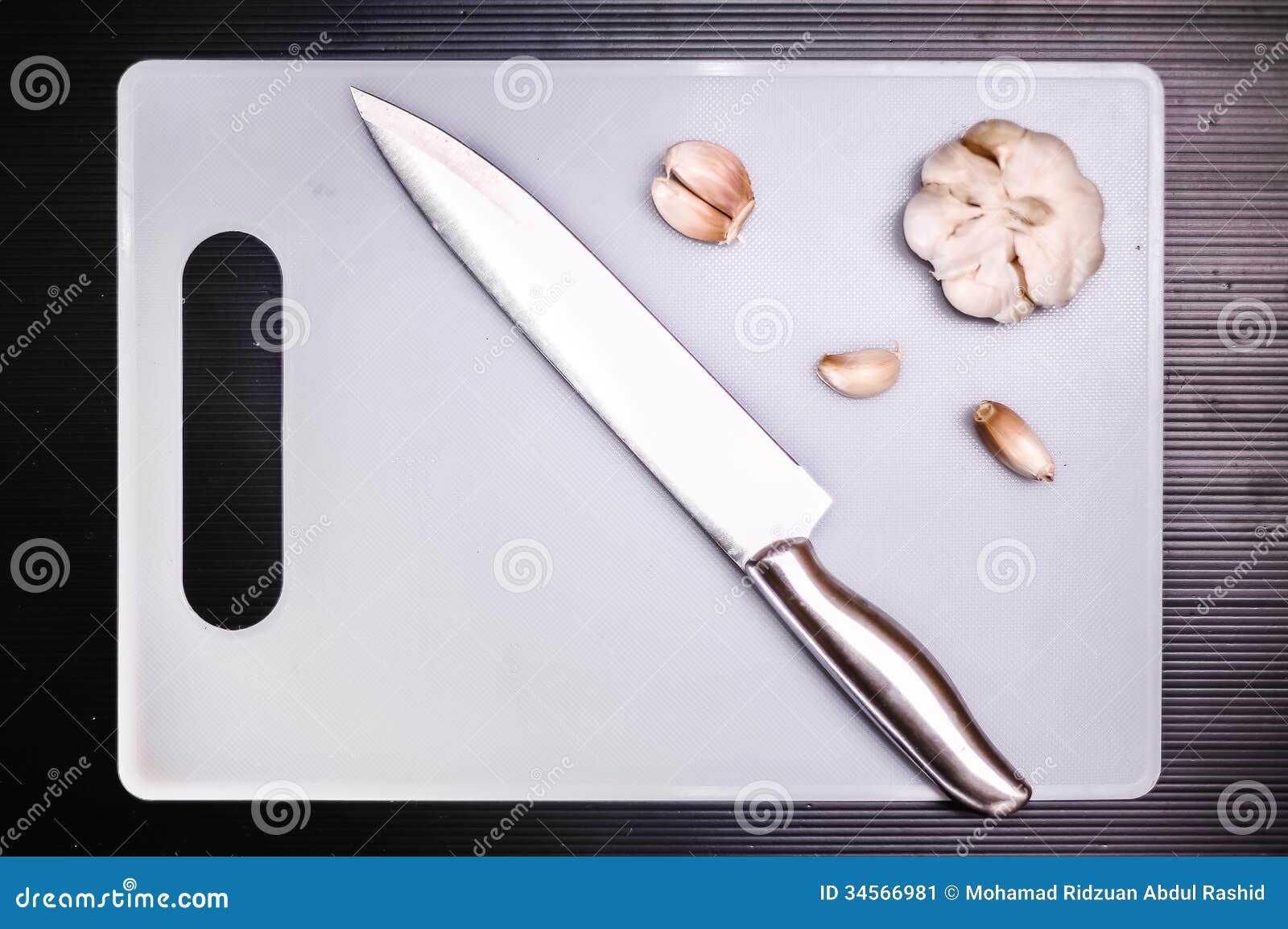 Garlic and Knife on Cutting Board Stock Image Image of ingredients