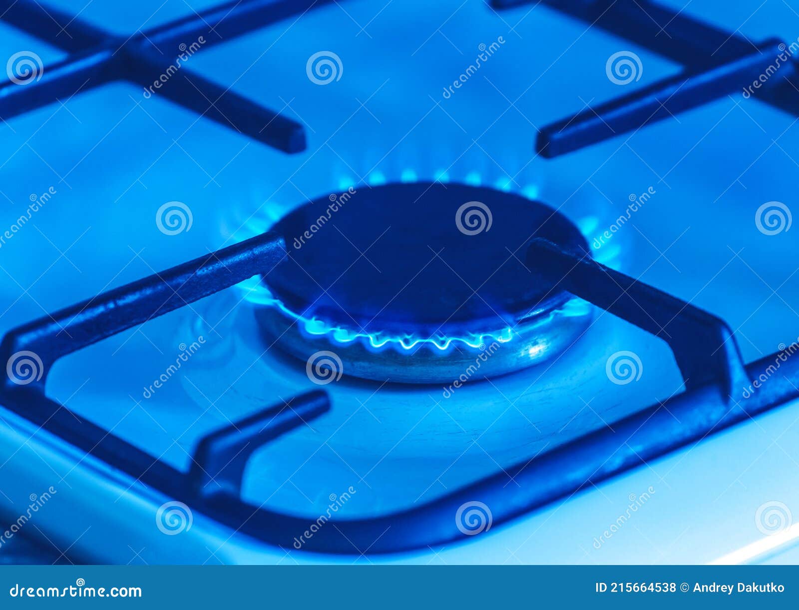Gas Burner with a Blue Flame on a Gas Stove, Closeup Stock Photo