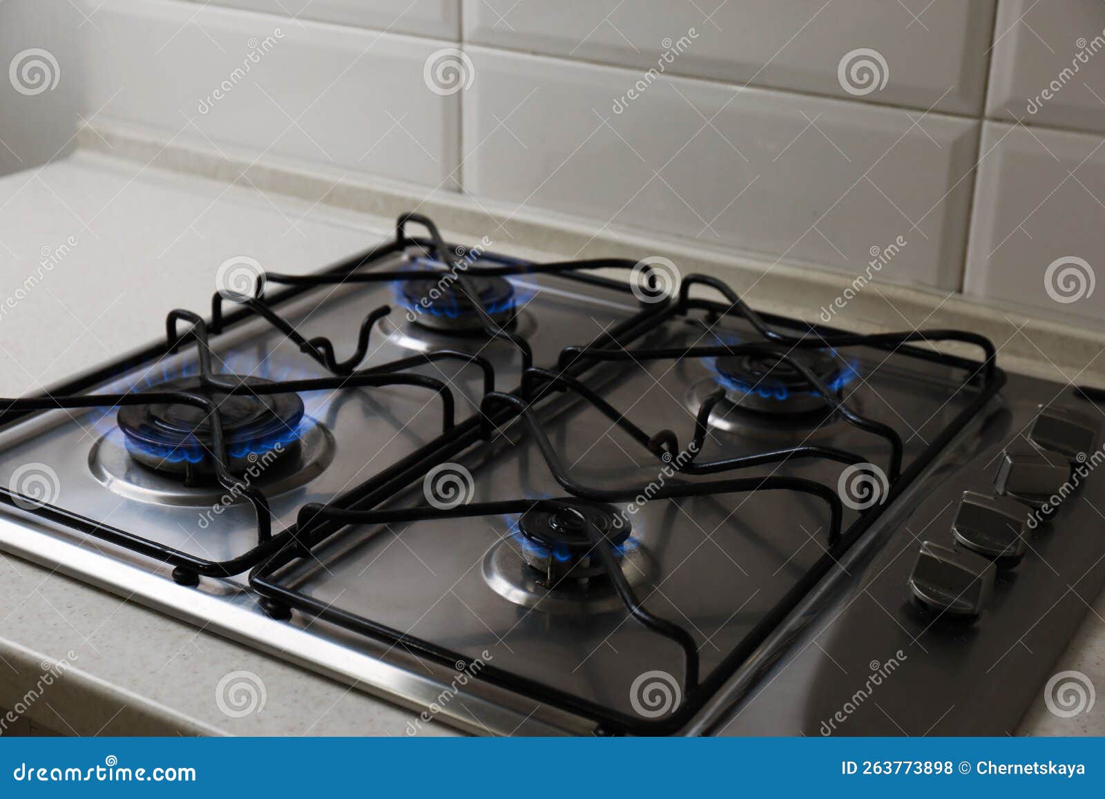Gas Cooktop with Burning Blue Flames in Kitchen Stock Photo Image of
