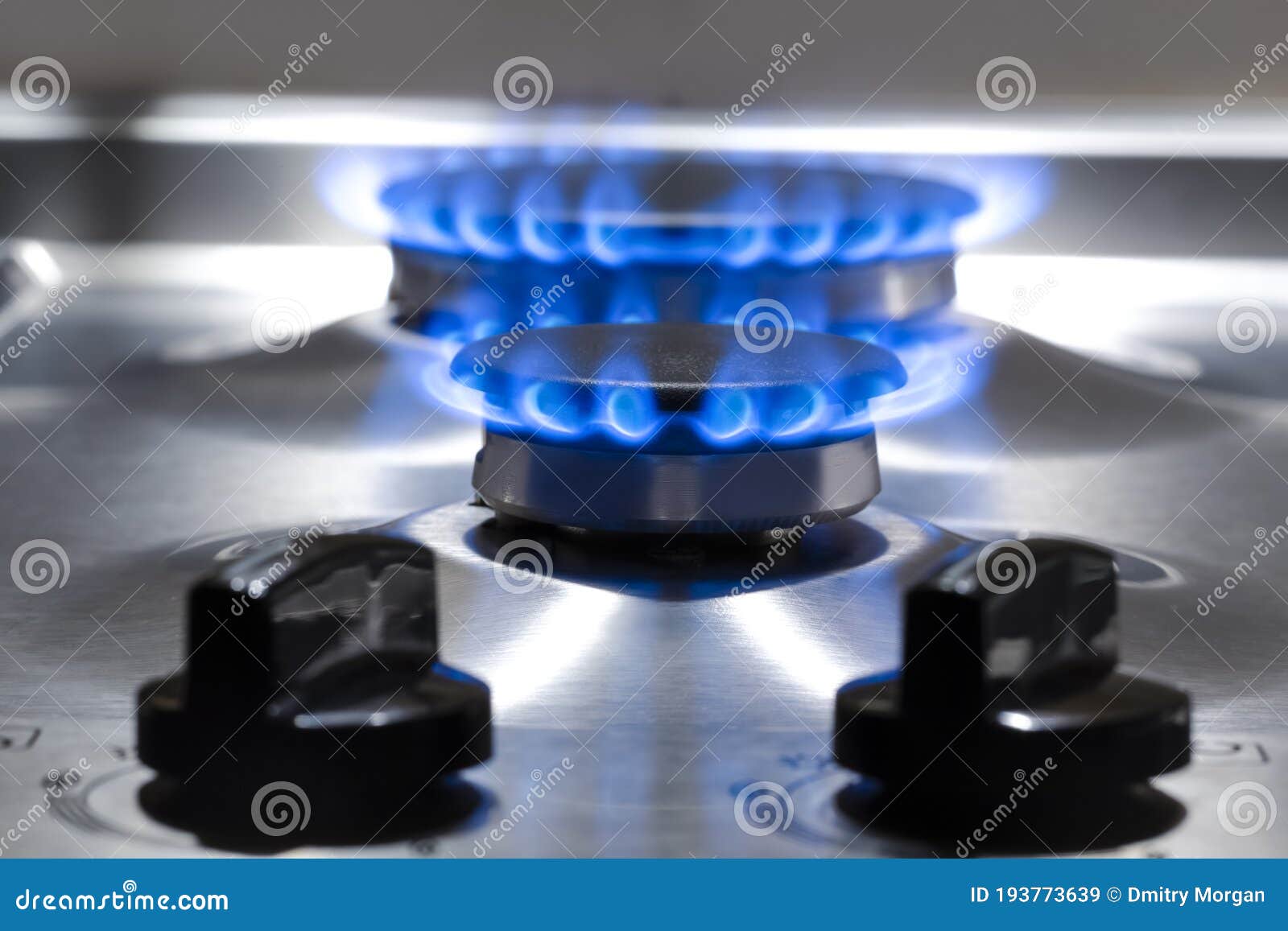 Gas Oven Concepts. Macro Shoot of Two Gas Burners on Stove Surface with