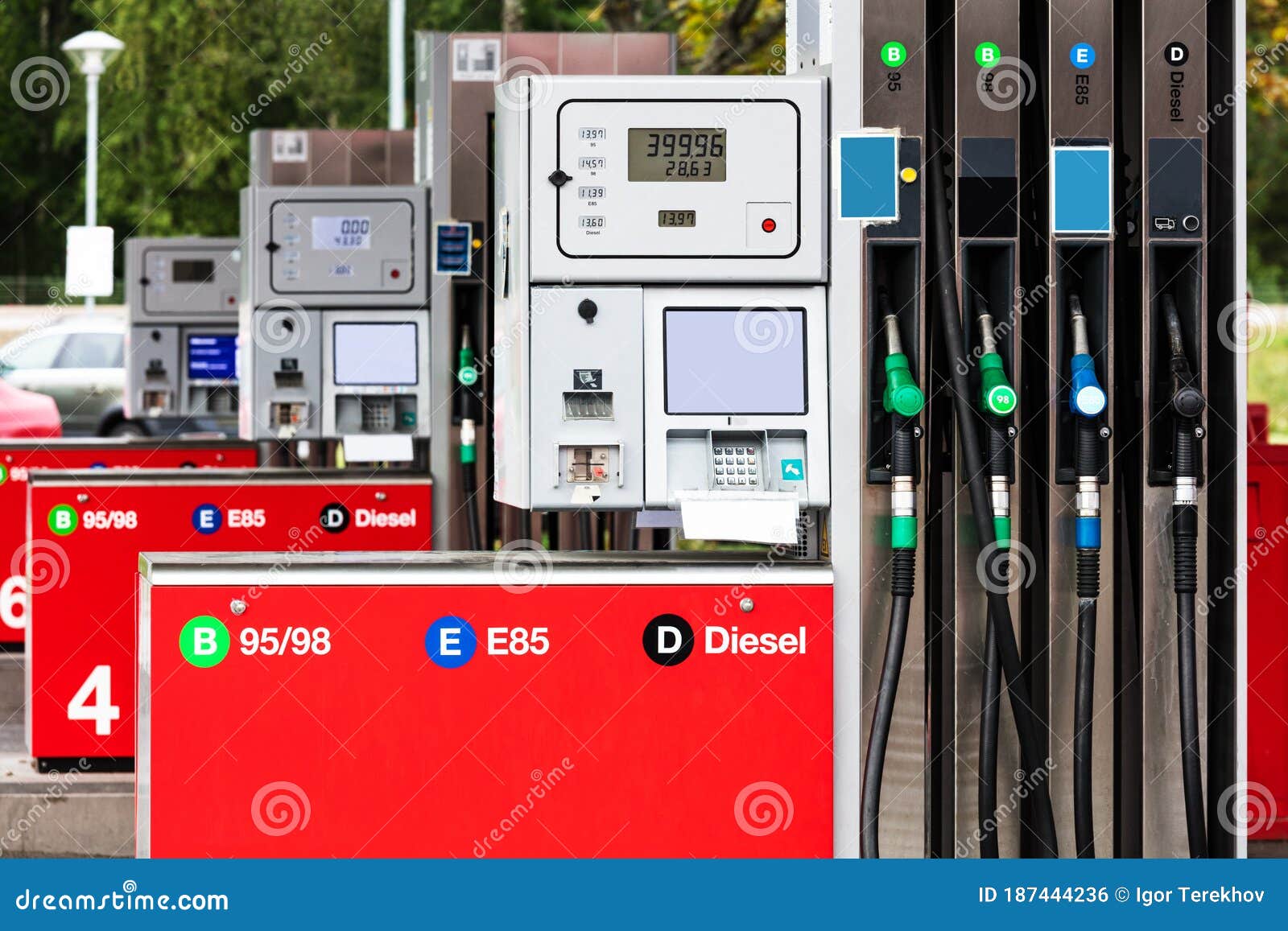 Nozzles In The Gas Station. A Diesel Dispenser That Is Filling Up With