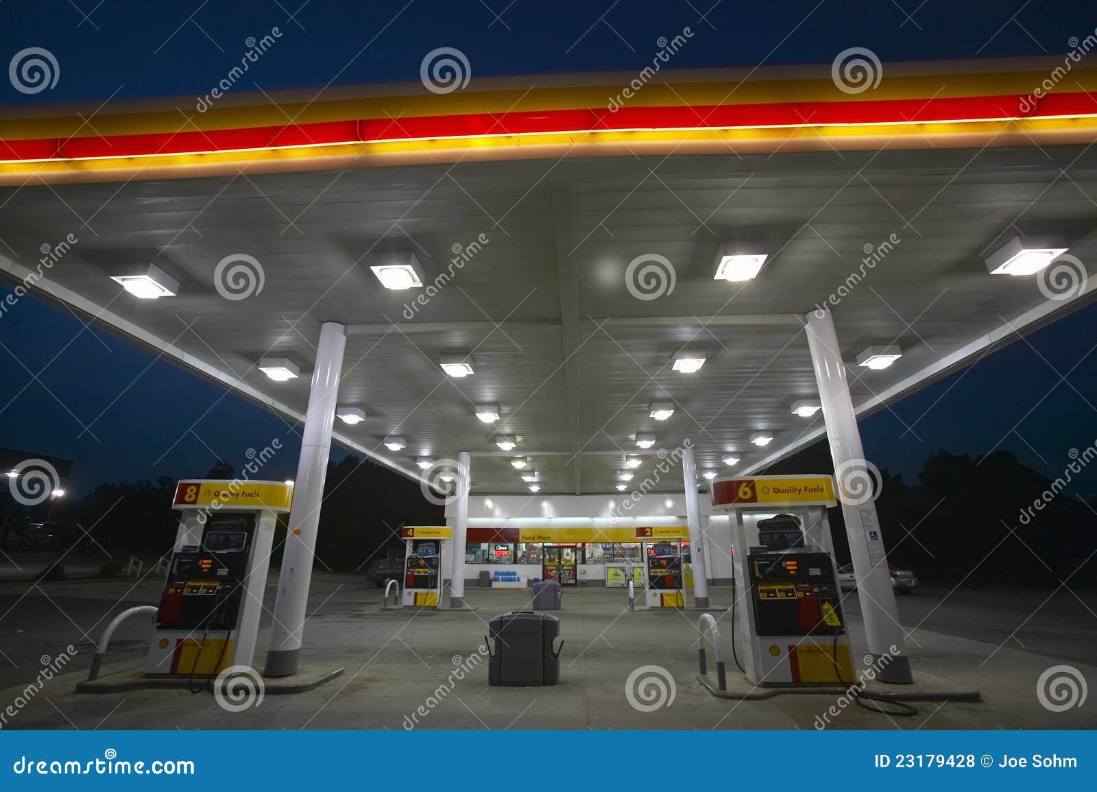 Gas Station with lights on editorial stock photo. Image of 23179428