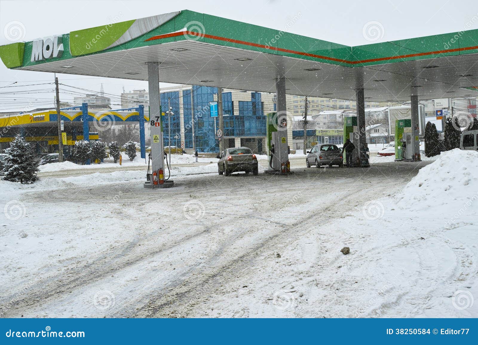 Gas station in winter time editorial stock image. Image of asphalt
