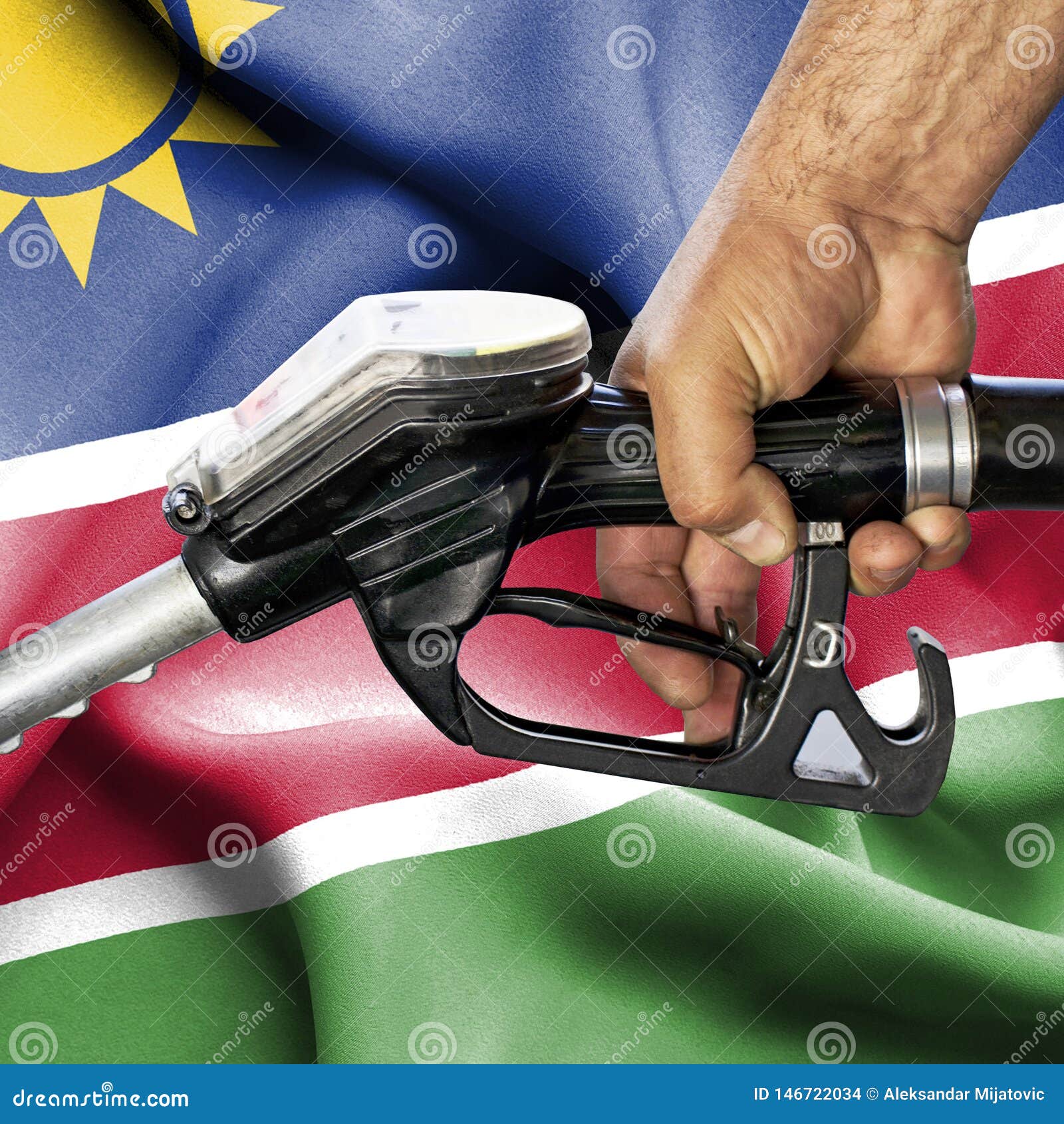 Gasoline Consumption Concept Hand Holding Hose Against Flag of Namibia Stock Photo Image of