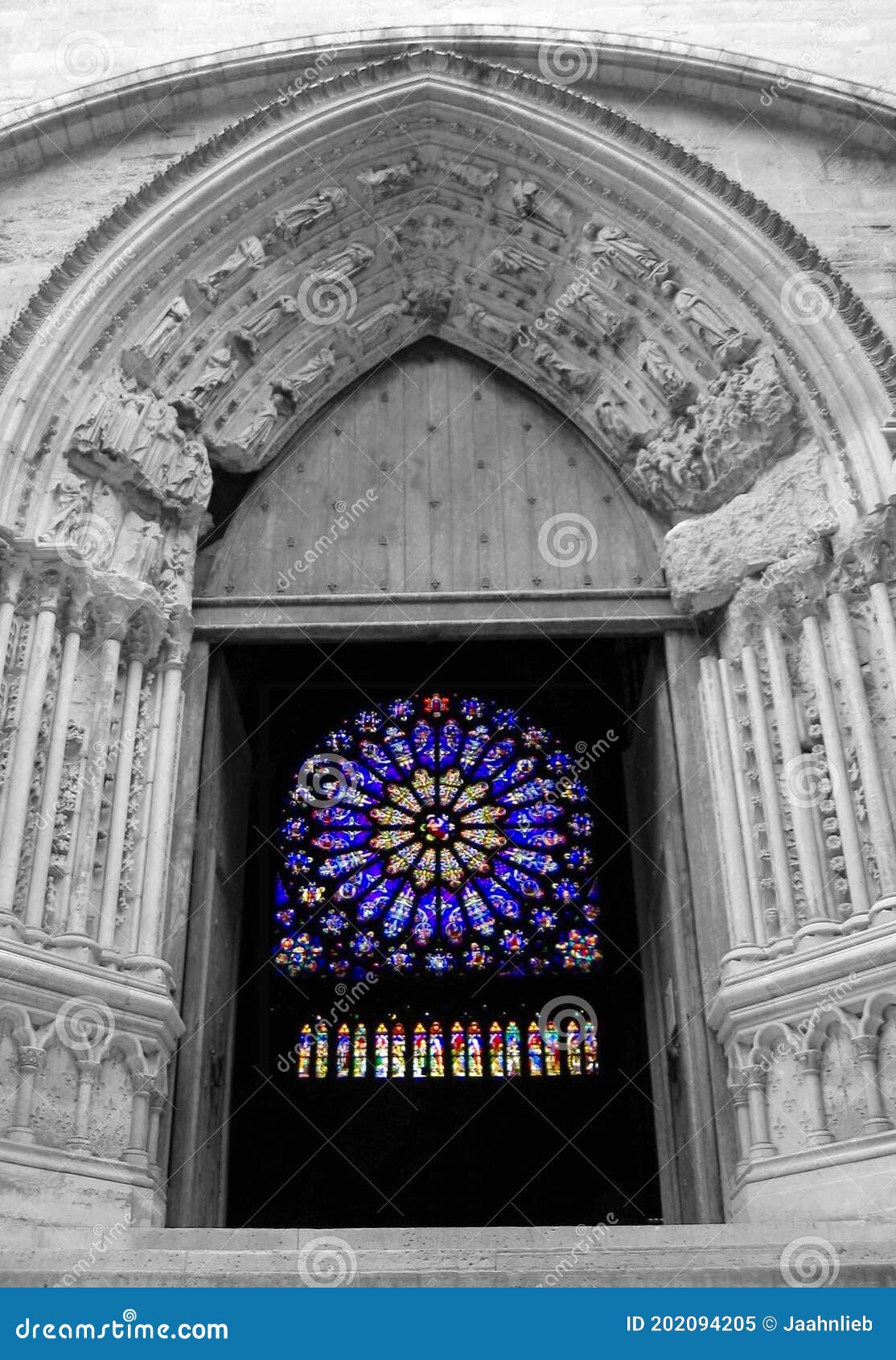 saint denis cathedral gate to south transept and beautiful stained-glass windows, paris, france