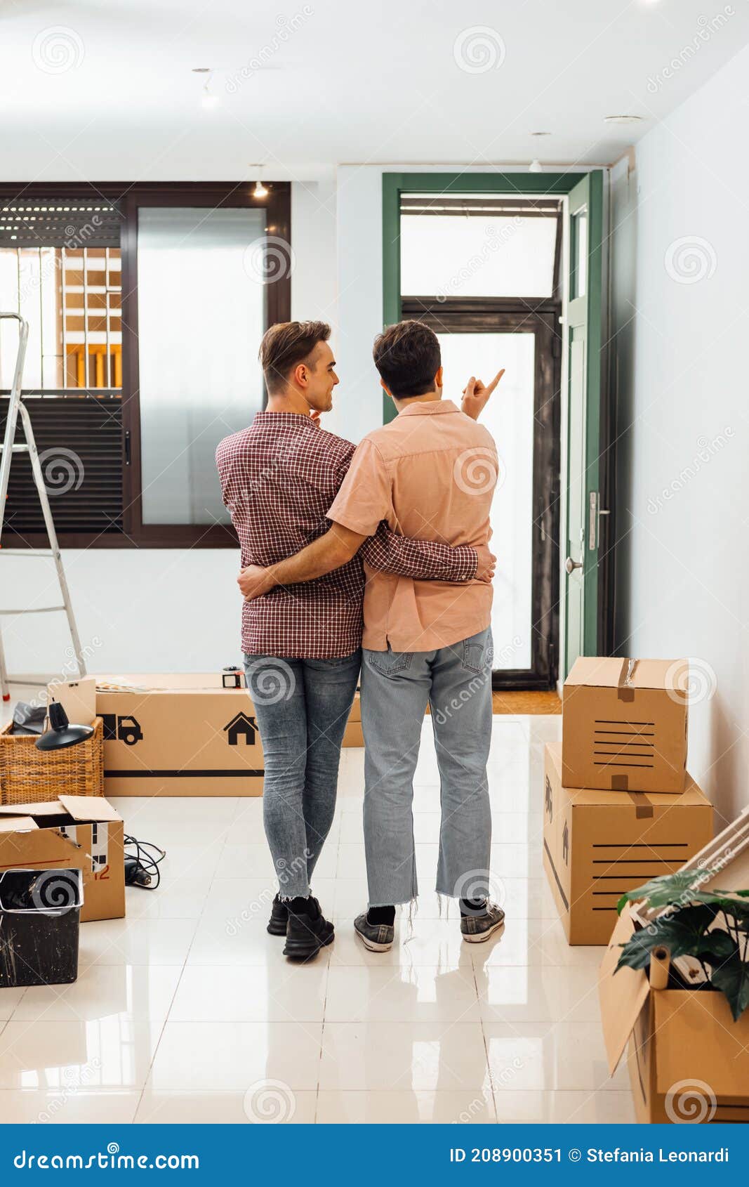 Gay Couple Deciding How To Decorate the New Home Stock Image ...