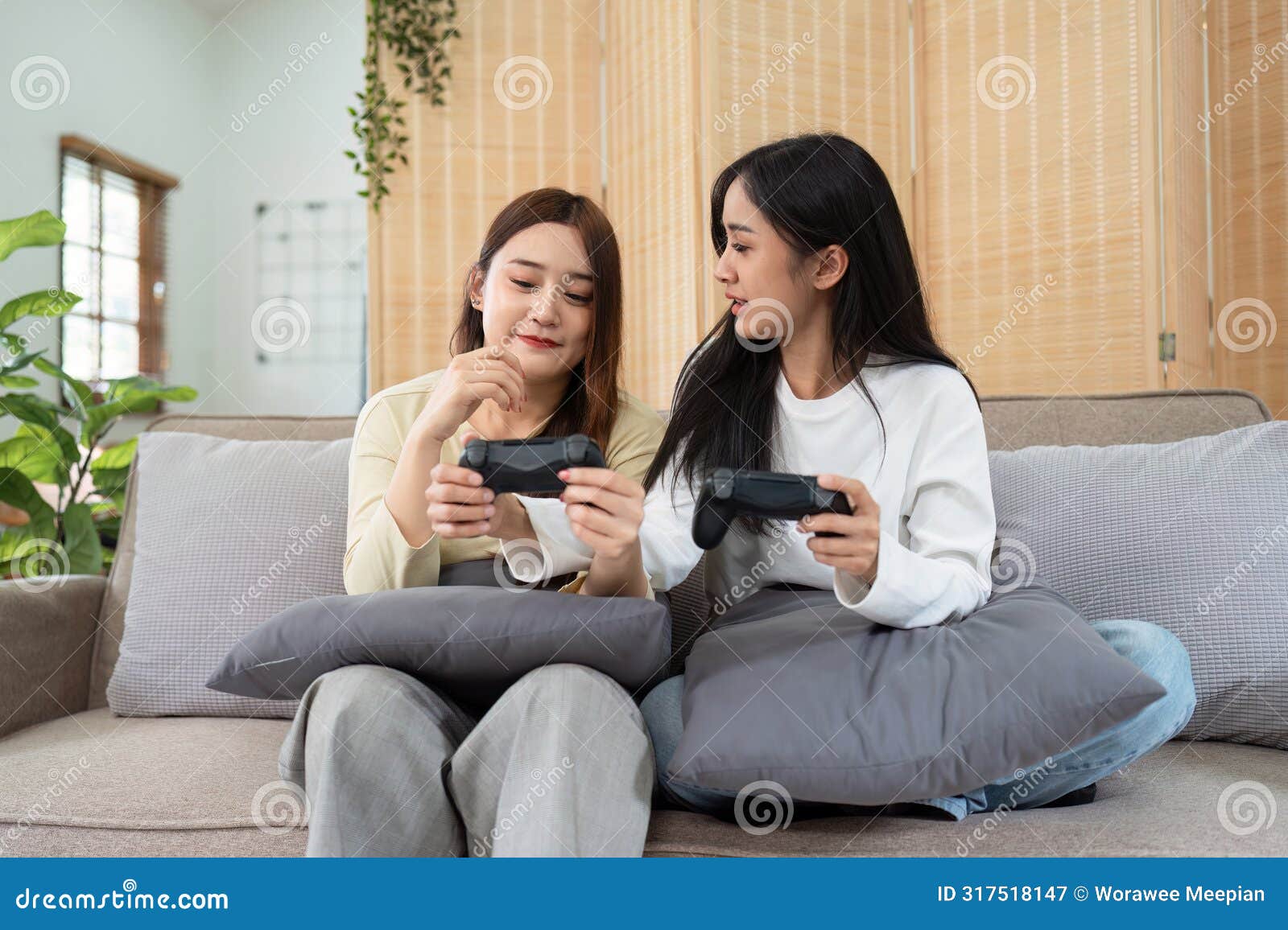 gay couple hug on sofa to relax together in healthy relationship love connection. lgbtq couple concept