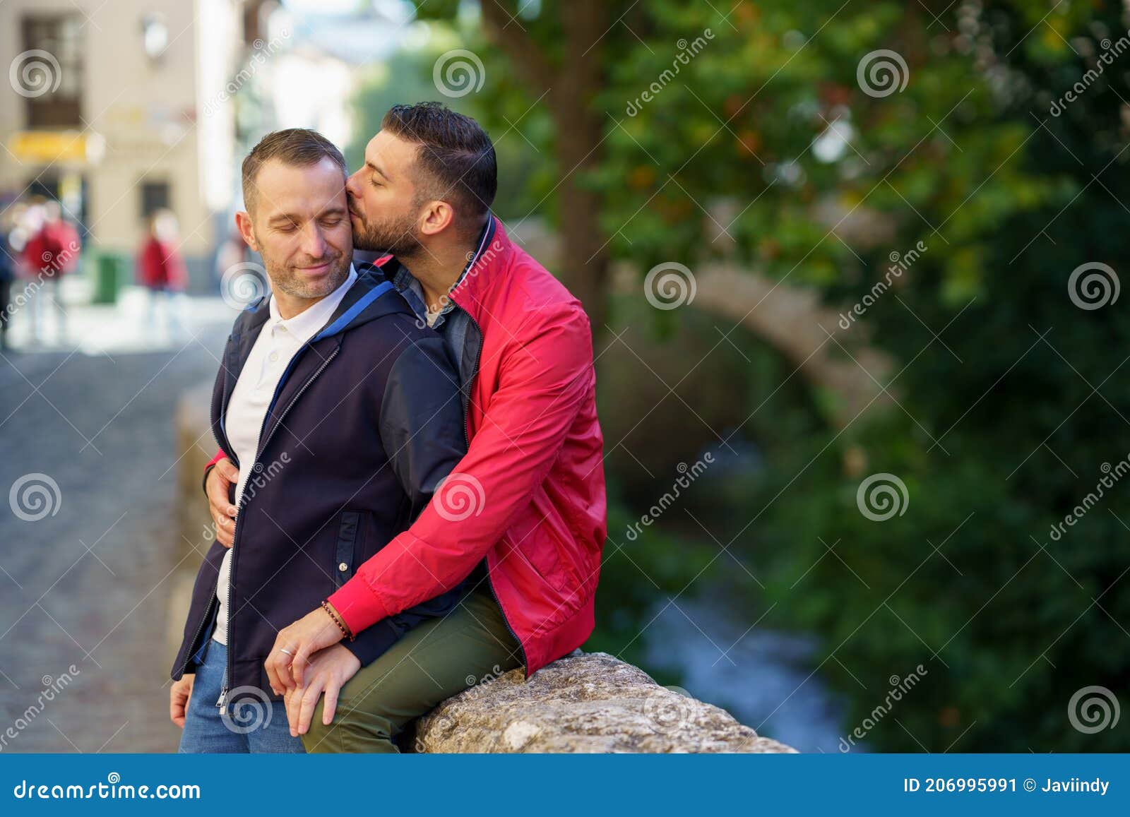 Gay Couple Kissing A Beautiful Place Near The River Stock Image