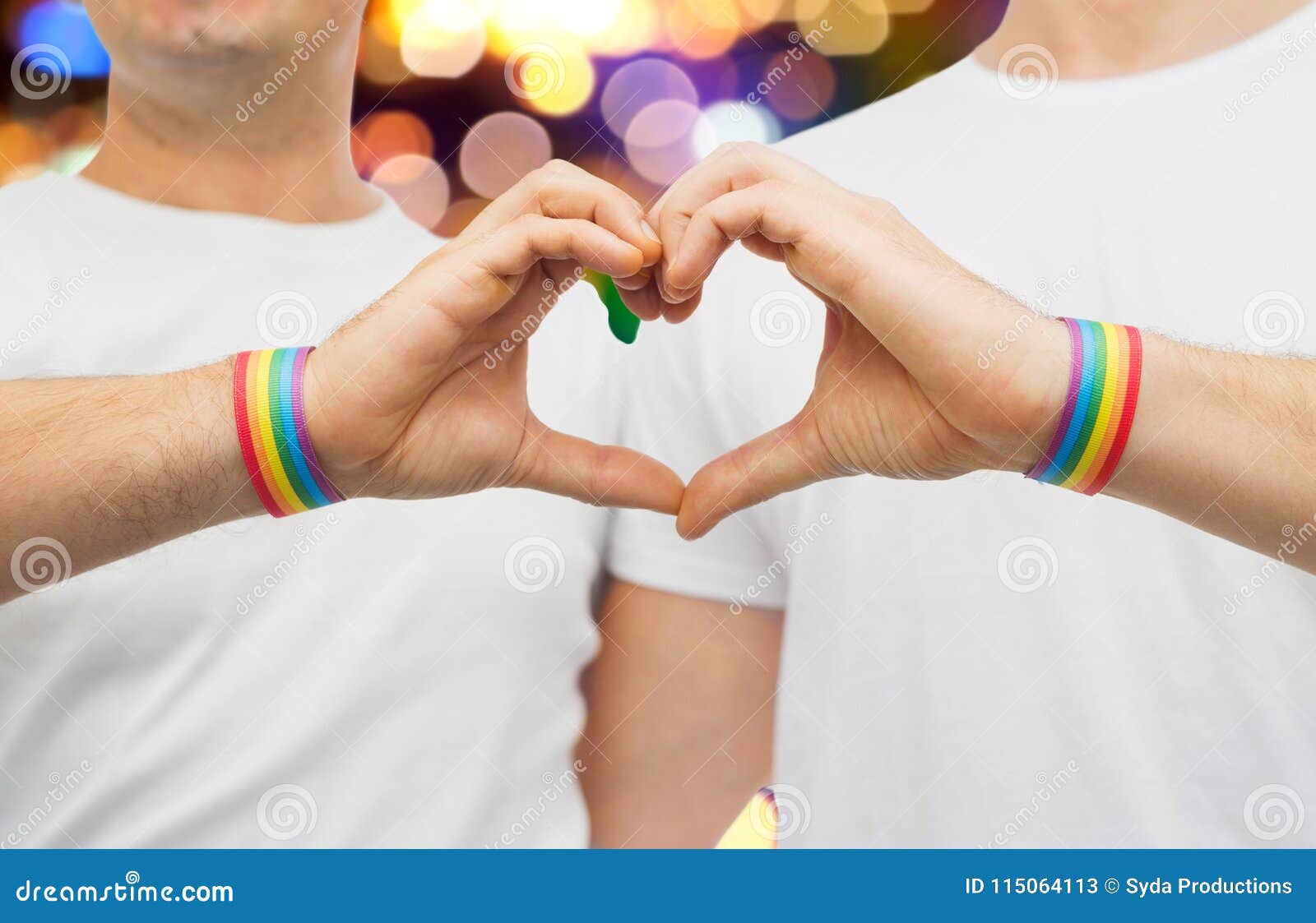 Gay Couple With Rainbow Wristbands And Hand Heart Stock Image Image