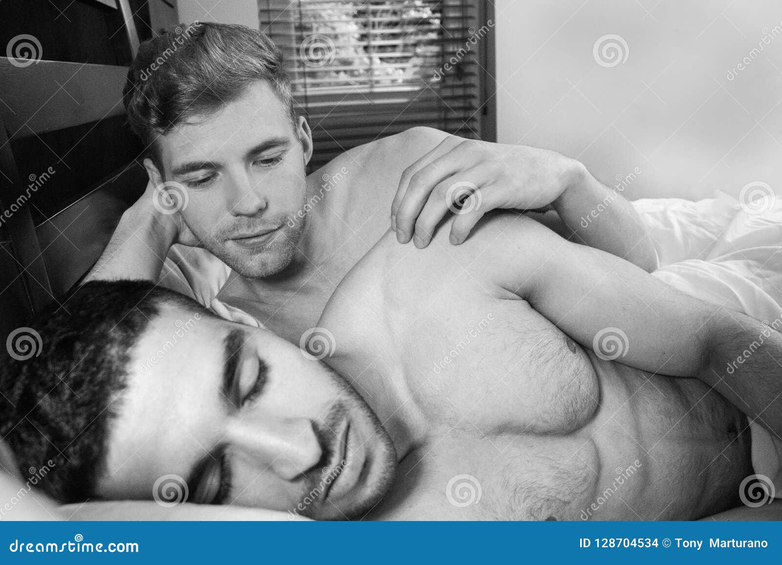 Gay Lovers Lying in Bed, One is Sleeping As the Other Watches Him Stock  Photo - Image of male, handsome: 128704534