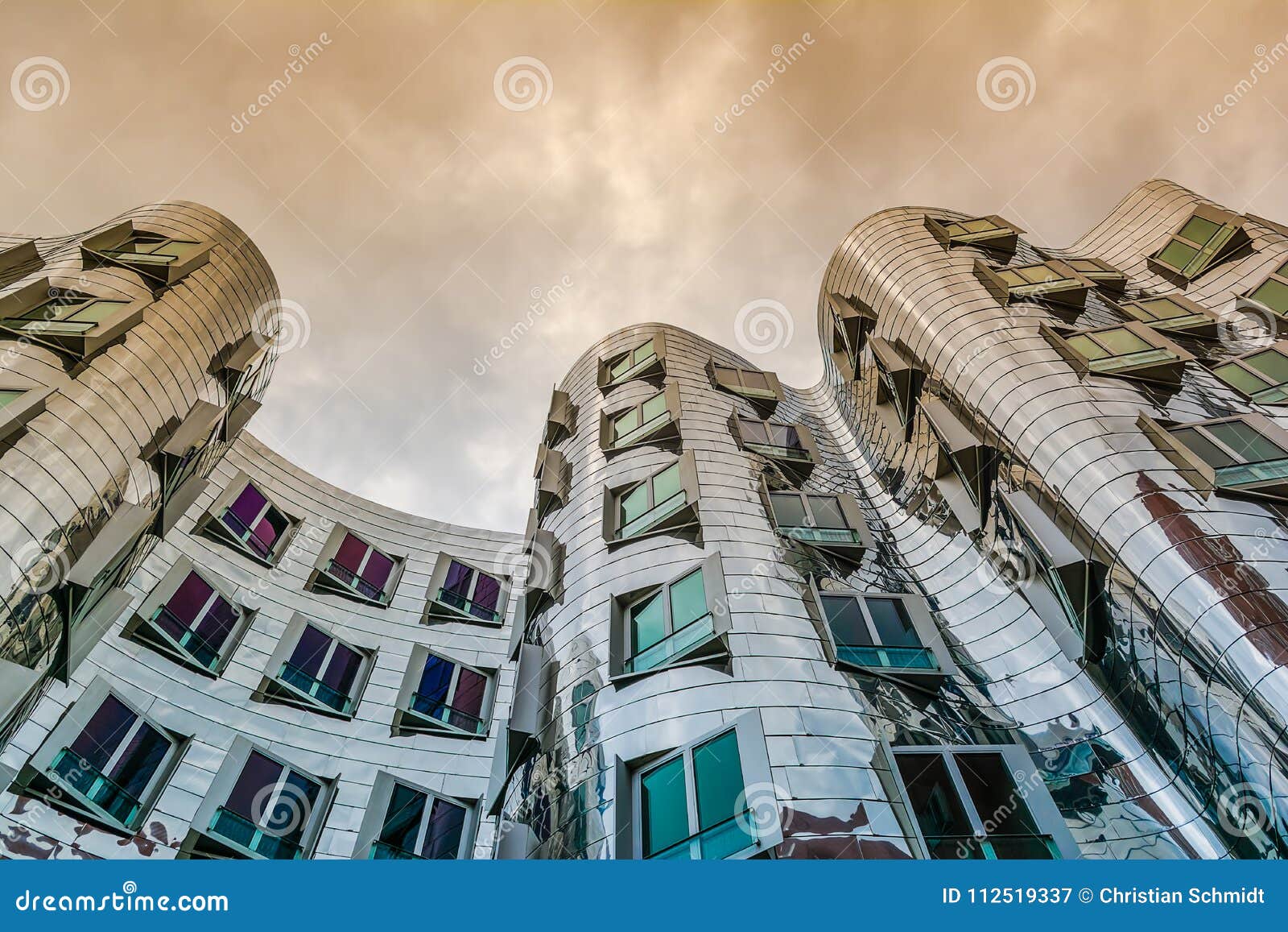 famous american architecture influenced the modern architecture of worldfamous american architect frank o gehry here displayed at neuer zollhof dsseldorfs medienhafen media port gehry house at in dsseldorf germany editorial famous american architecture influenced the modern architecture of worldfamous american architect frank o gehry here displayed at neuer zollhof dsseldorfs medienhafen media port gehry house at in dsseldorf germany editorial
