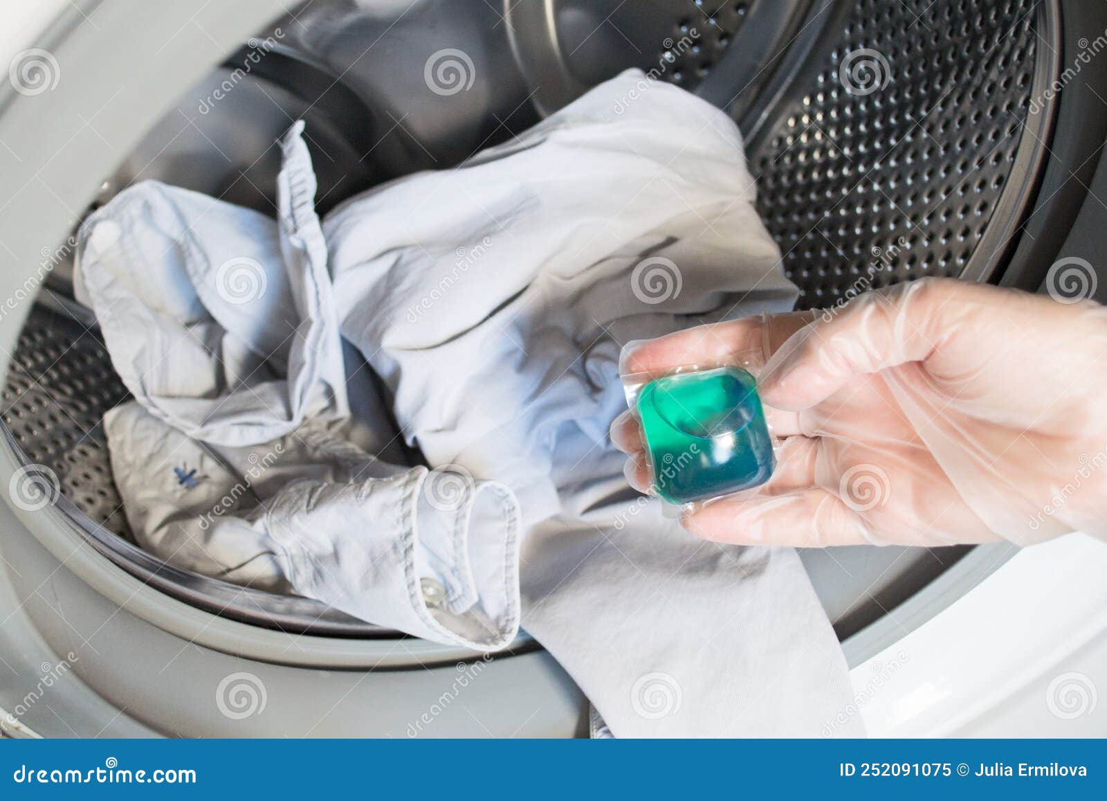 Gel Capsule for a Washing Machine. in the Hands of Throwing in a Drum