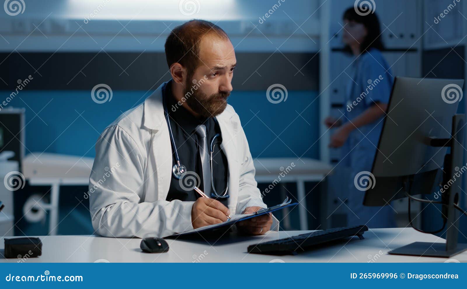 General Practitioner Checking Medical Report on Computer Comparing with Expertise Written on