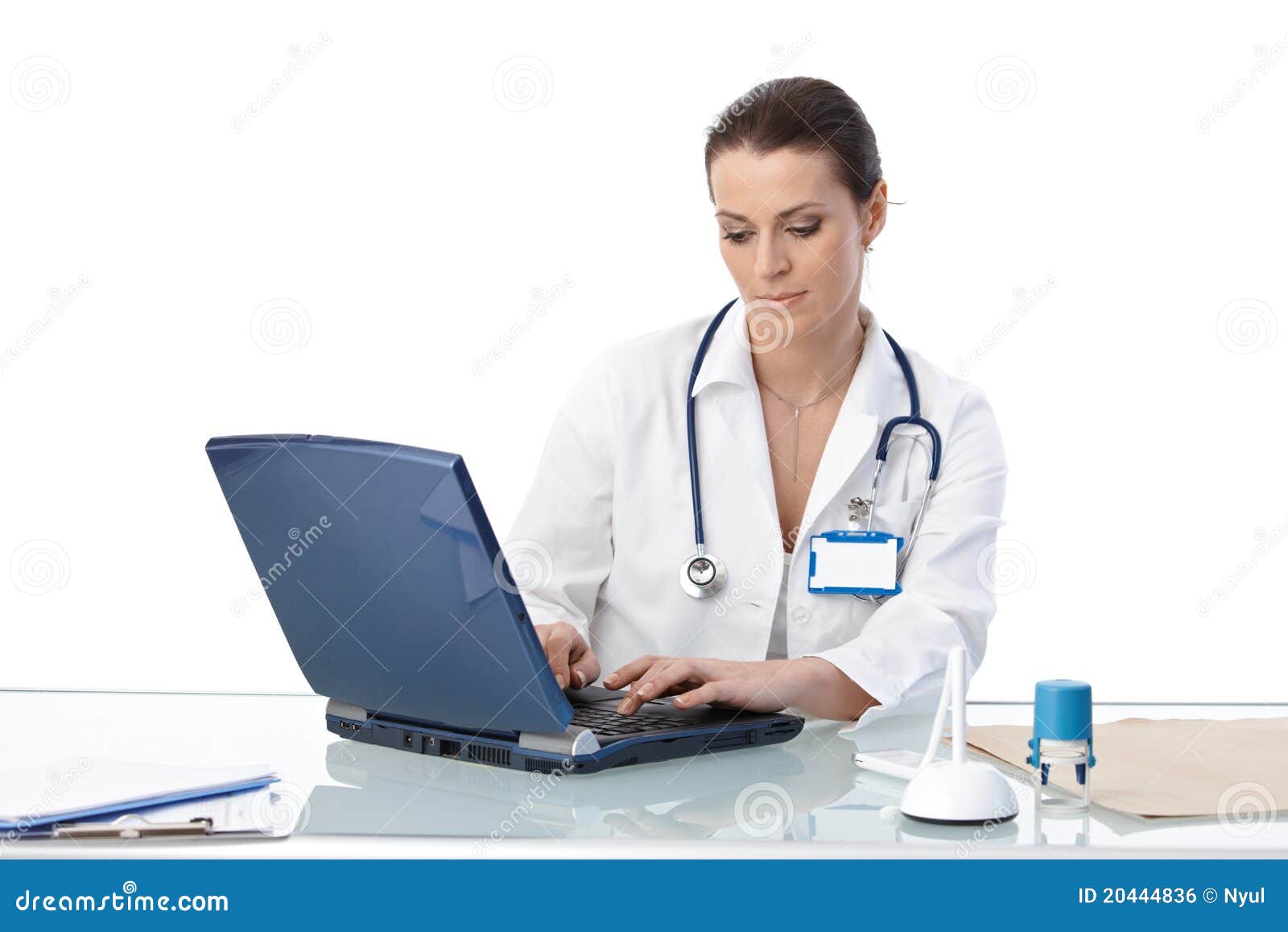general practitioner typing on computer