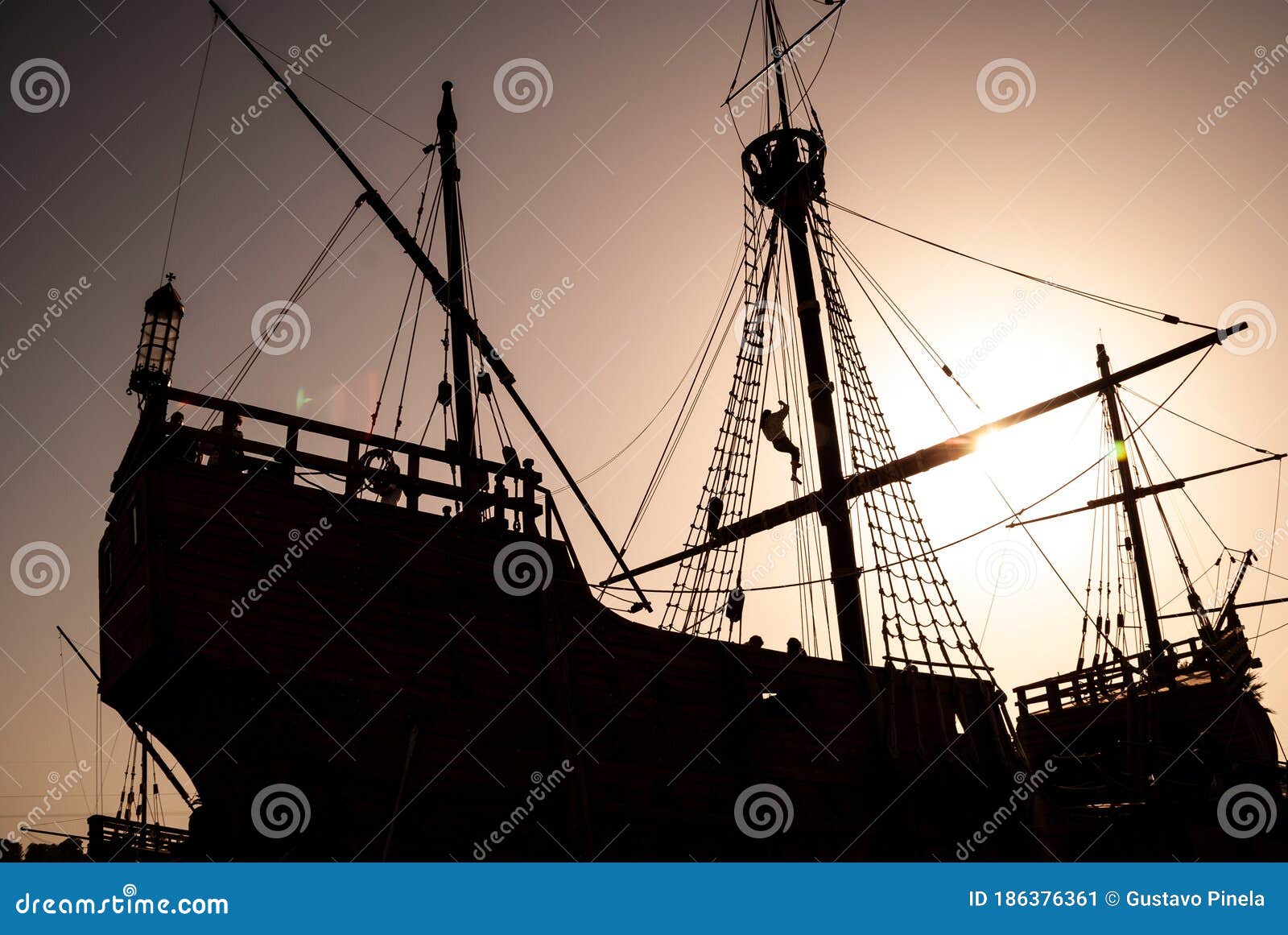 general shot, in silhouette, of an old caravel