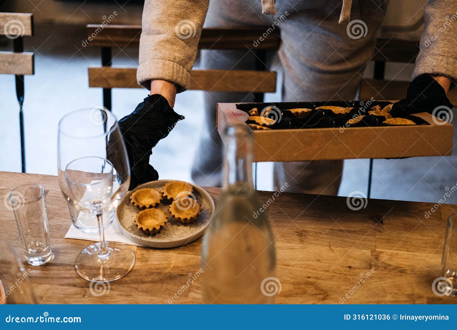 caterer arranging gourmet tartlets for event