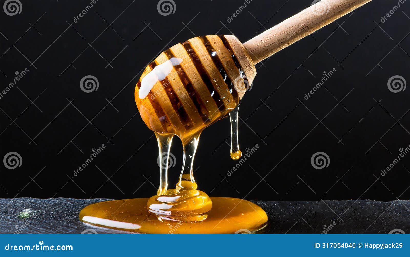 sweet viscous honey made by bees dripping from wooden dipper with spaced grooves