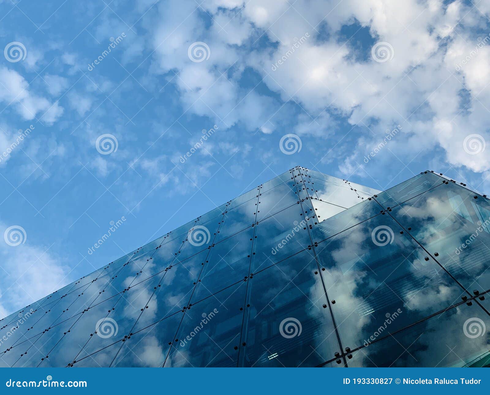 generic glass building in london with beautiful clear blue sky , modern architecture