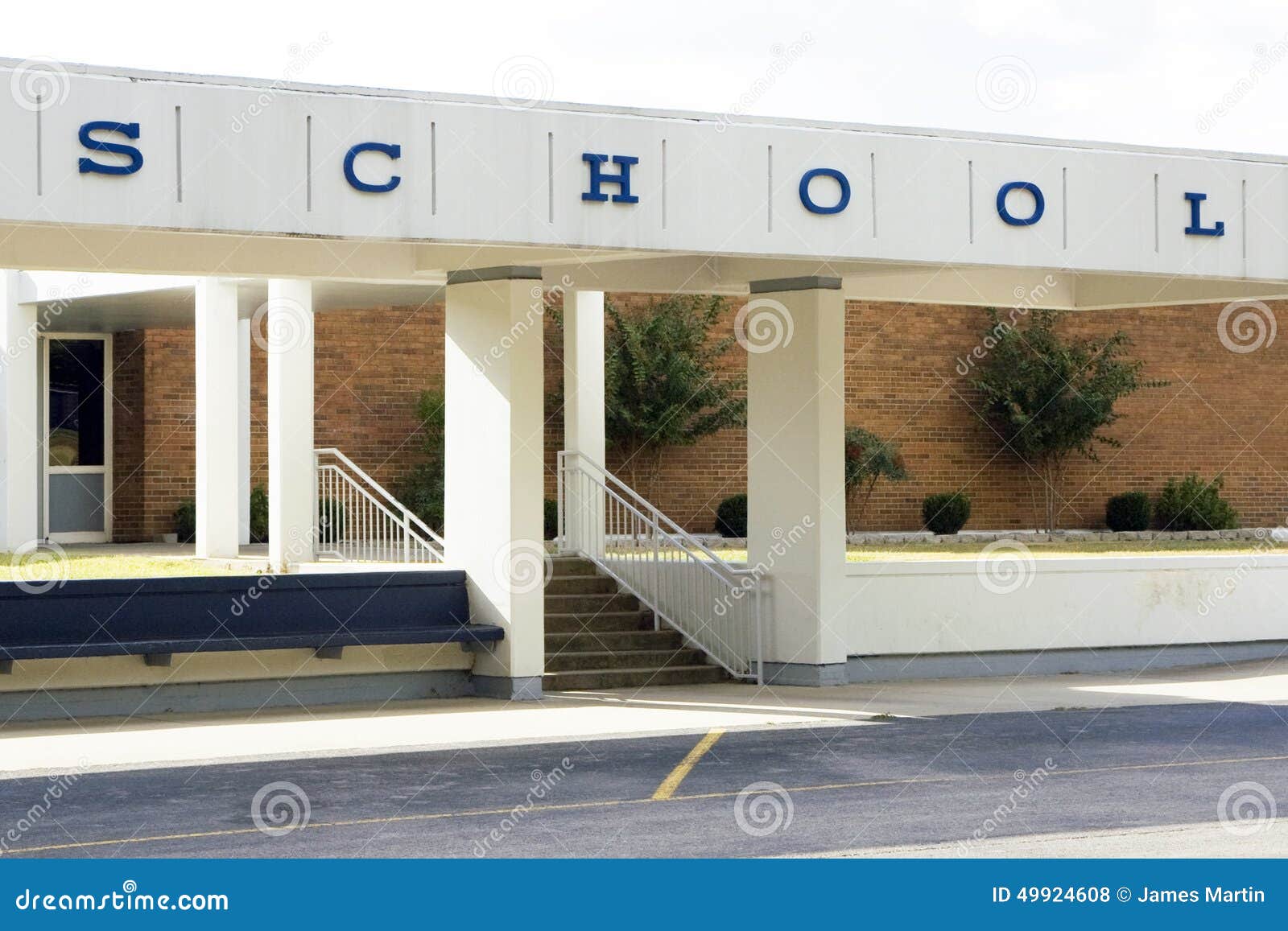 Generic school building. Modern school with generic school sign showing the entrance.